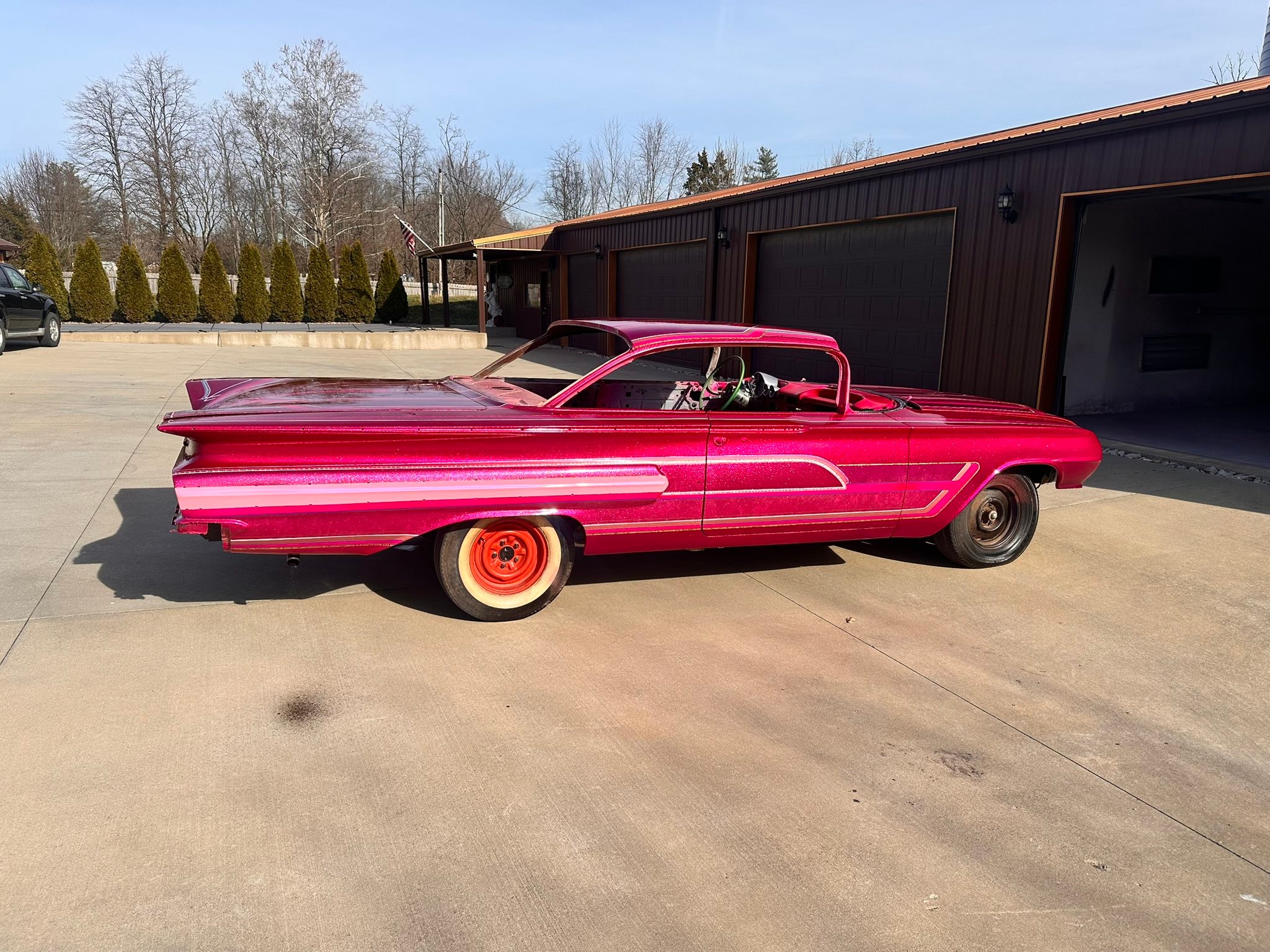 Kandy Koated Kustoms metal flake dancing under Kandy Magenta. We