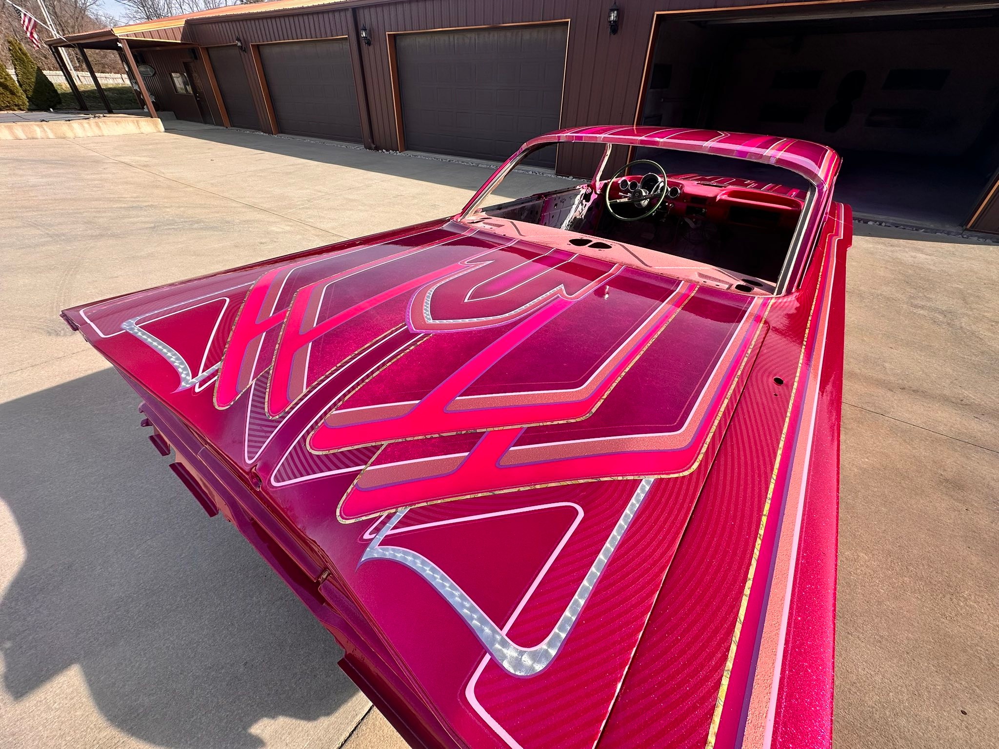 Kandy Koated Kustoms metal flake dancing under Kandy Magenta. We
