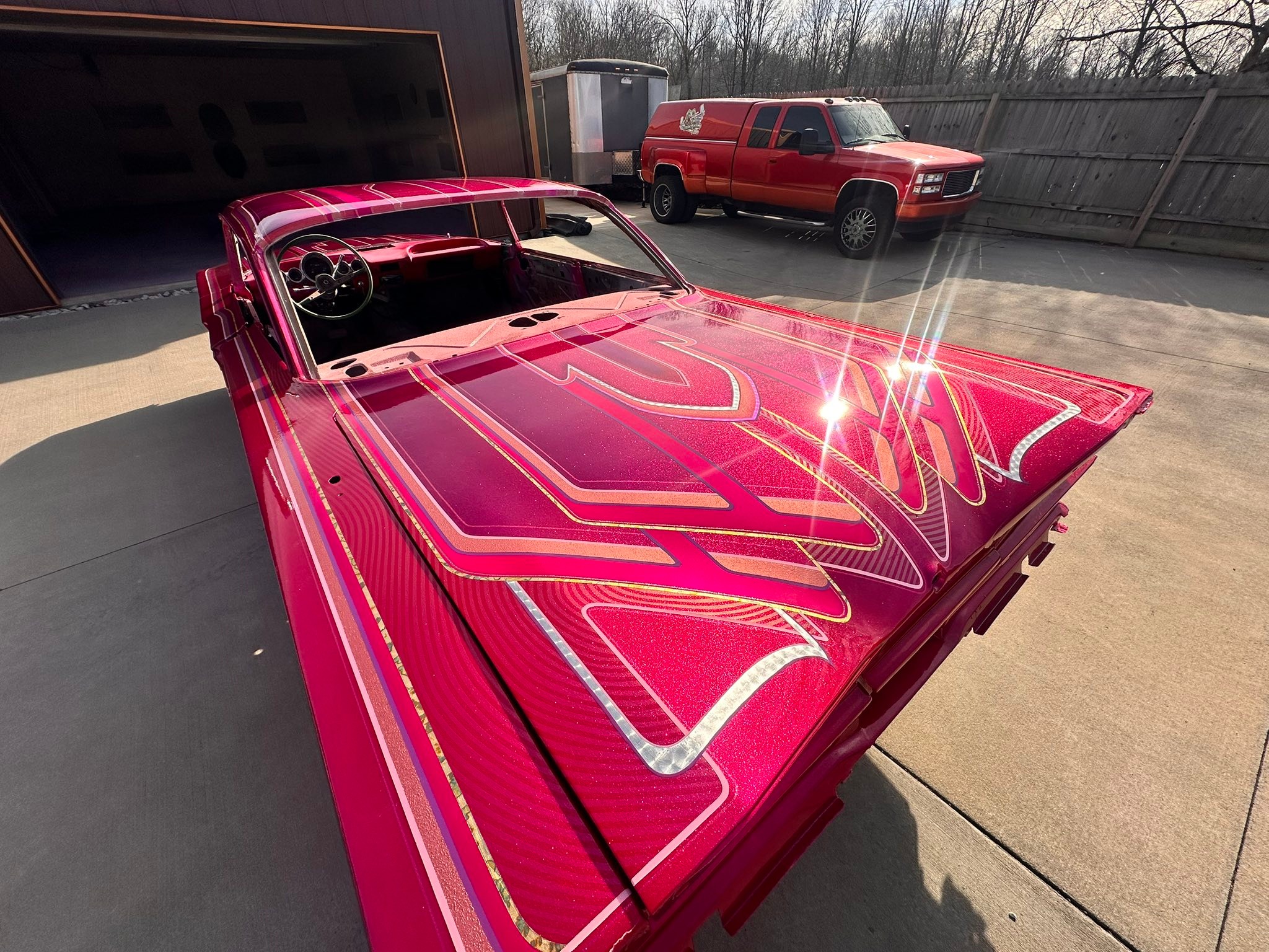 Kandy Koated Kustoms metal flake dancing under Kandy Magenta. We