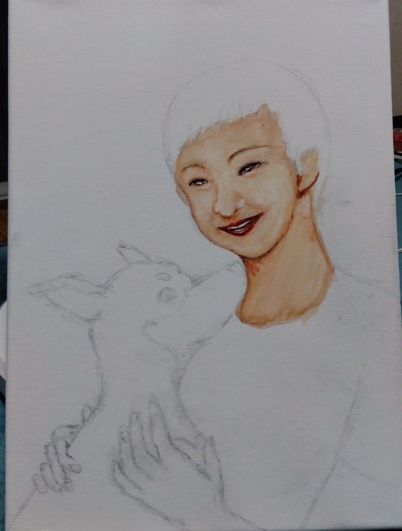 亡き愛犬と私を描いてます。