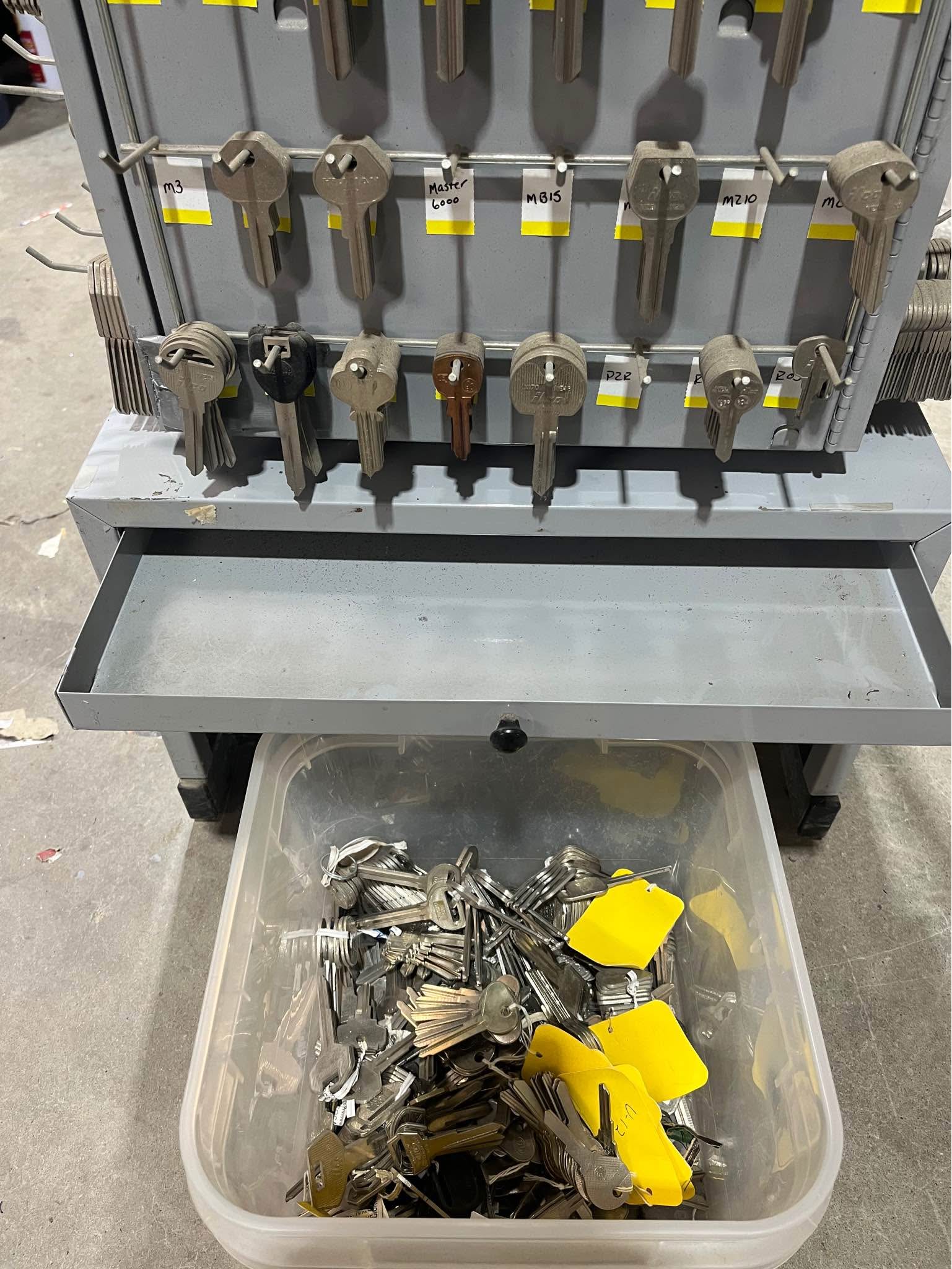 Key making kiosk. Rotating store key display rack with hundreds of ...