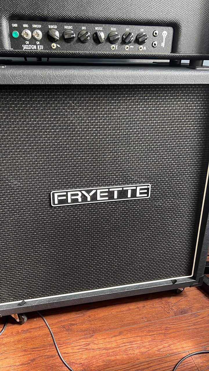 A Fatboy in black with salt & pepper grill cloth, white piping and