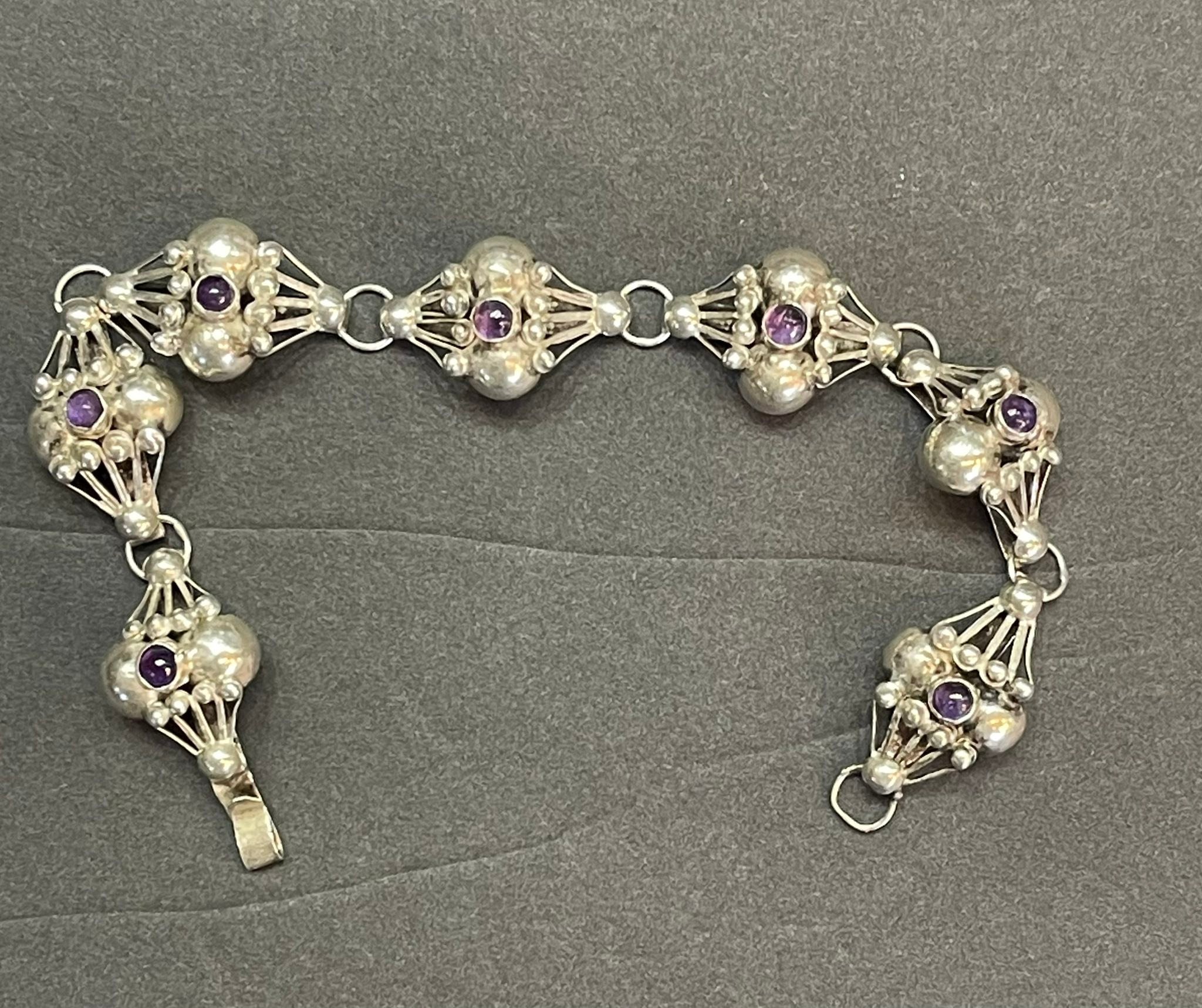 What is the origin and value of this vintage Mexican silver jewelry?
