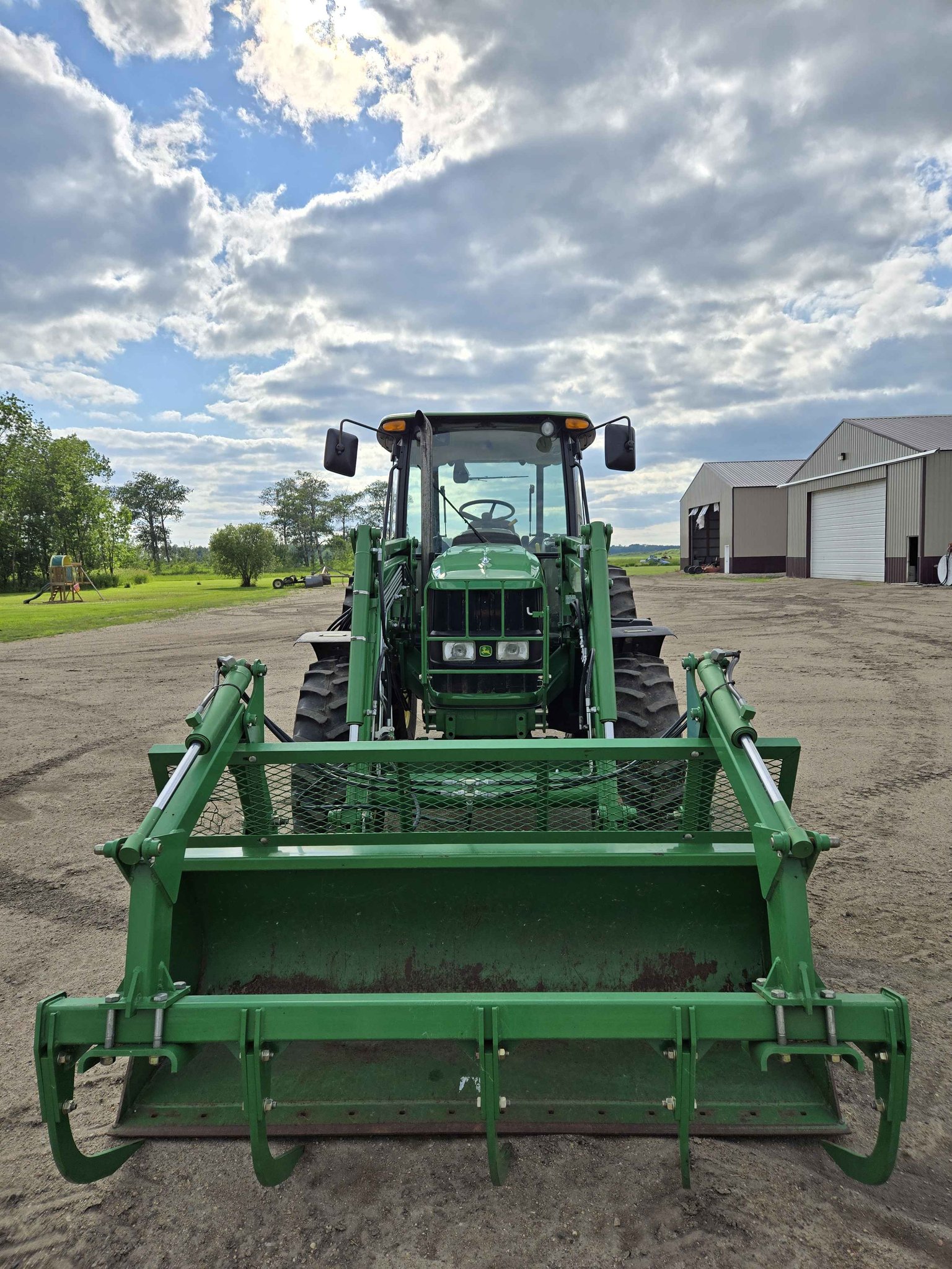 2012 John Deere 6115D