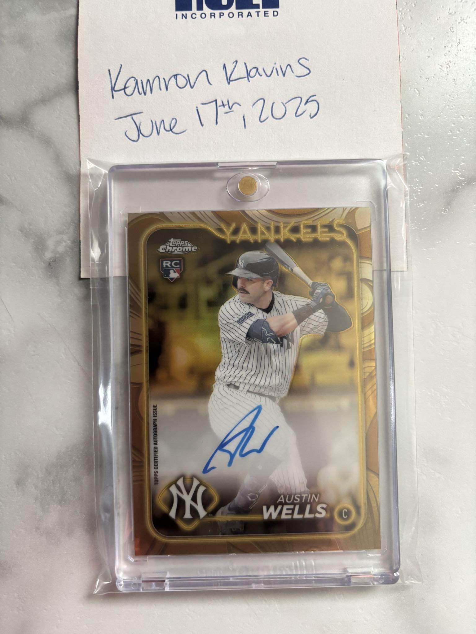 This 2024 Topps Tribute baseball card features Austin Wells, a 