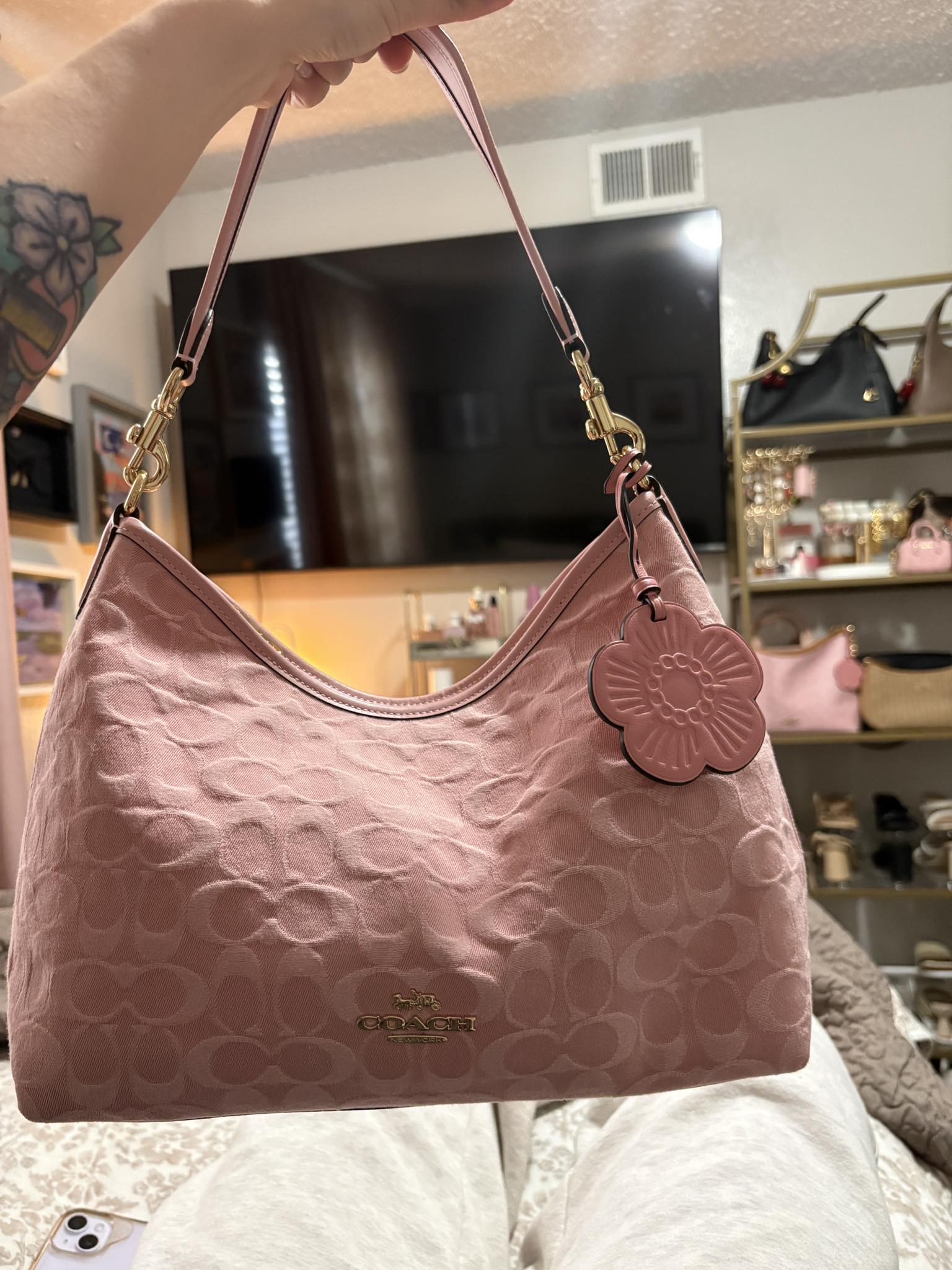 Coach pink handbag with flower charm