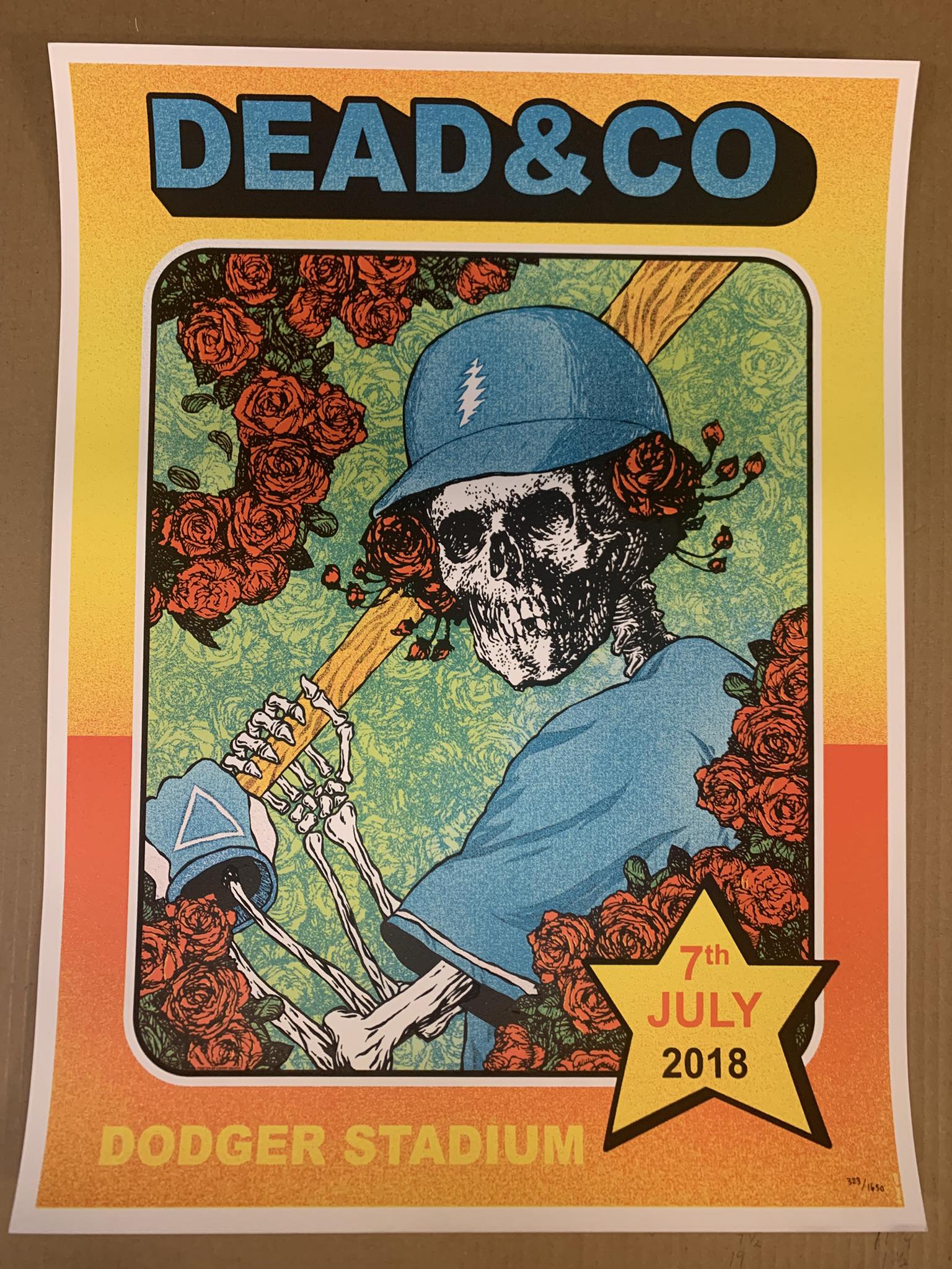 Where can I find the Dead and Company poster from the concert?