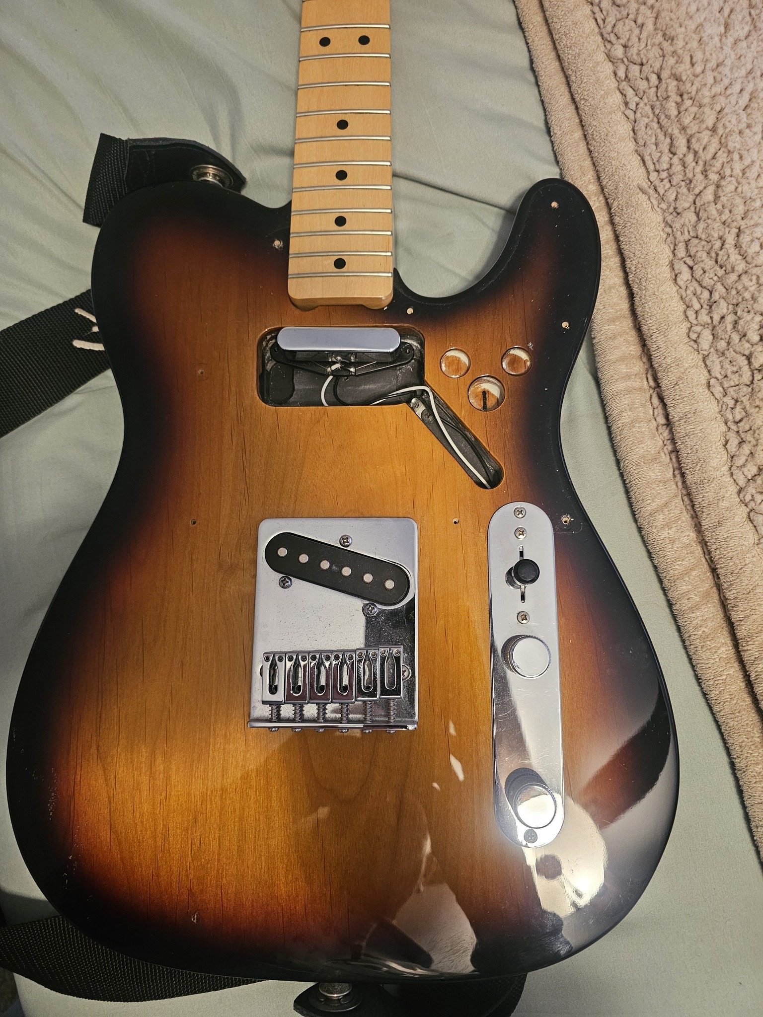What are the 3 holes in a 2013 Mexican Fender Telecaster body for?
