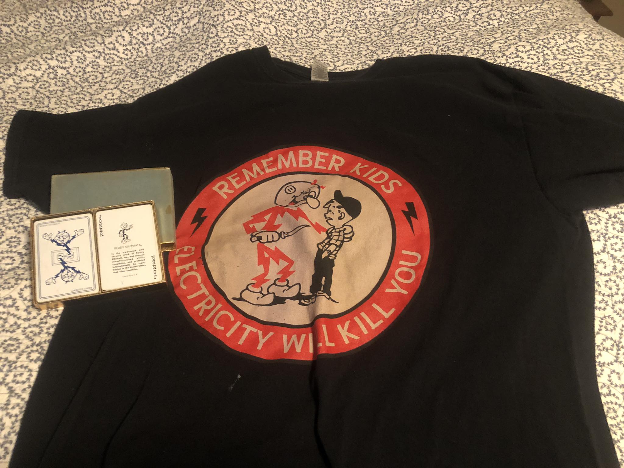 Finding Reddy Kilowatt shirt and cards at estate sale