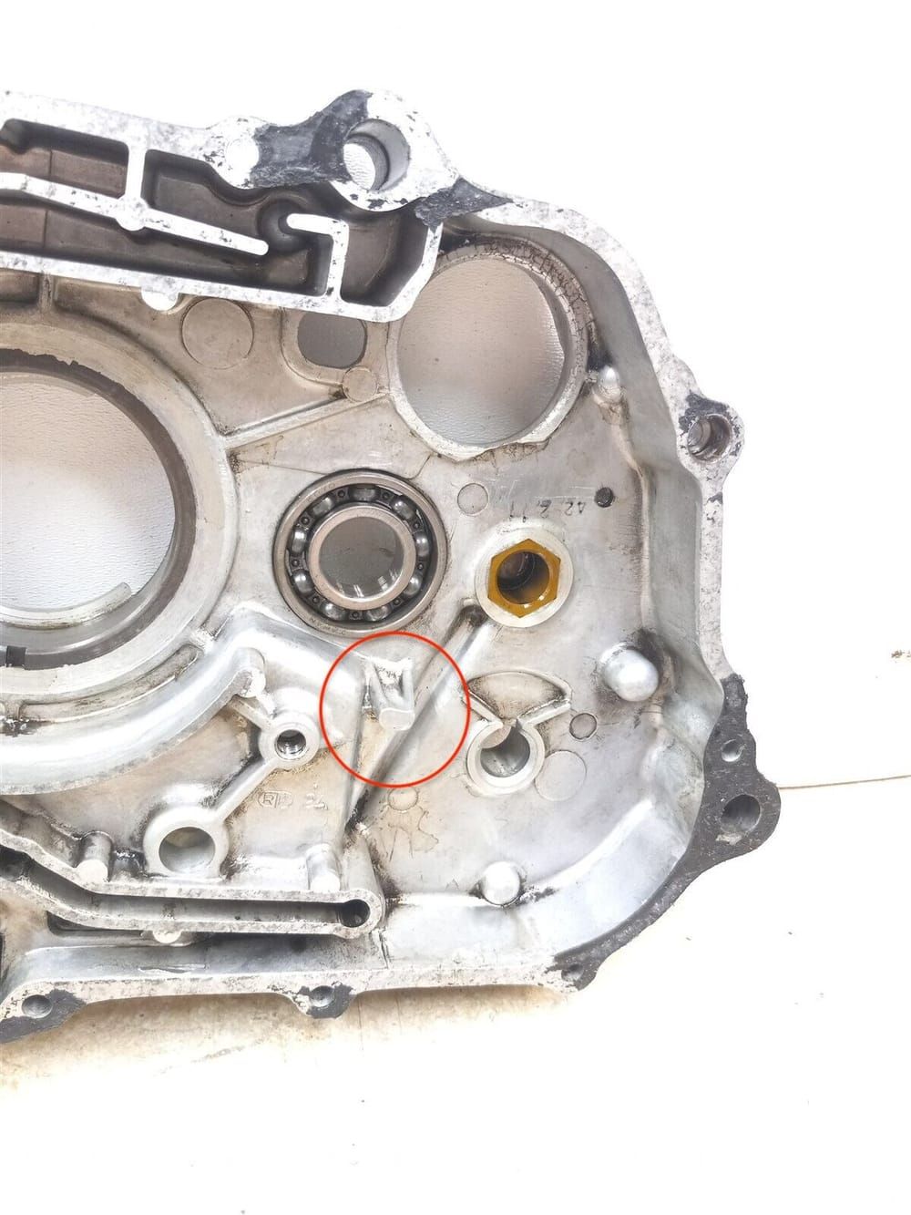 My engine has the early kickstart design with the stop cast into