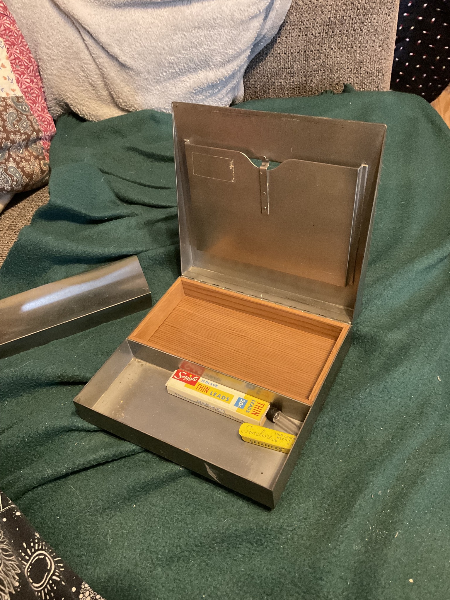 Vintage wooden cigar box is brown with a hinged lid and metal