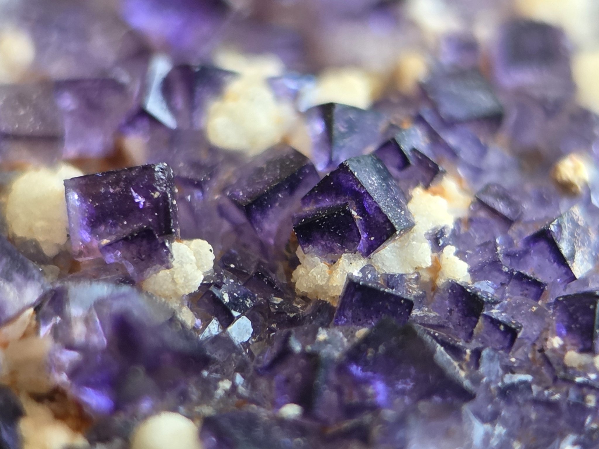 Vibrant purple fluorite, composed of calcium and fluoride, exposed