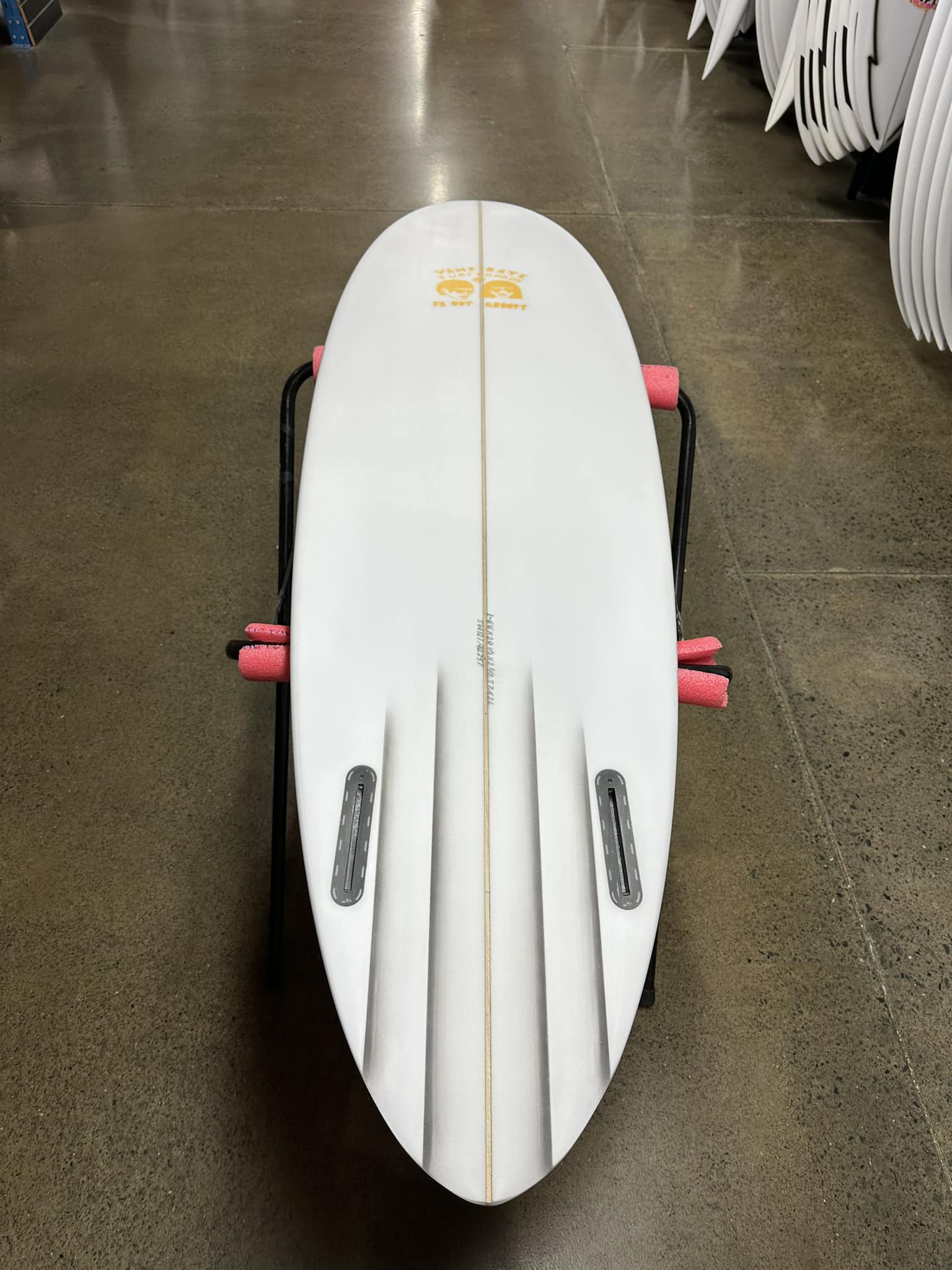 New Vampirate surfboard with bevelled rail and Mayhem Evil Twin fins
