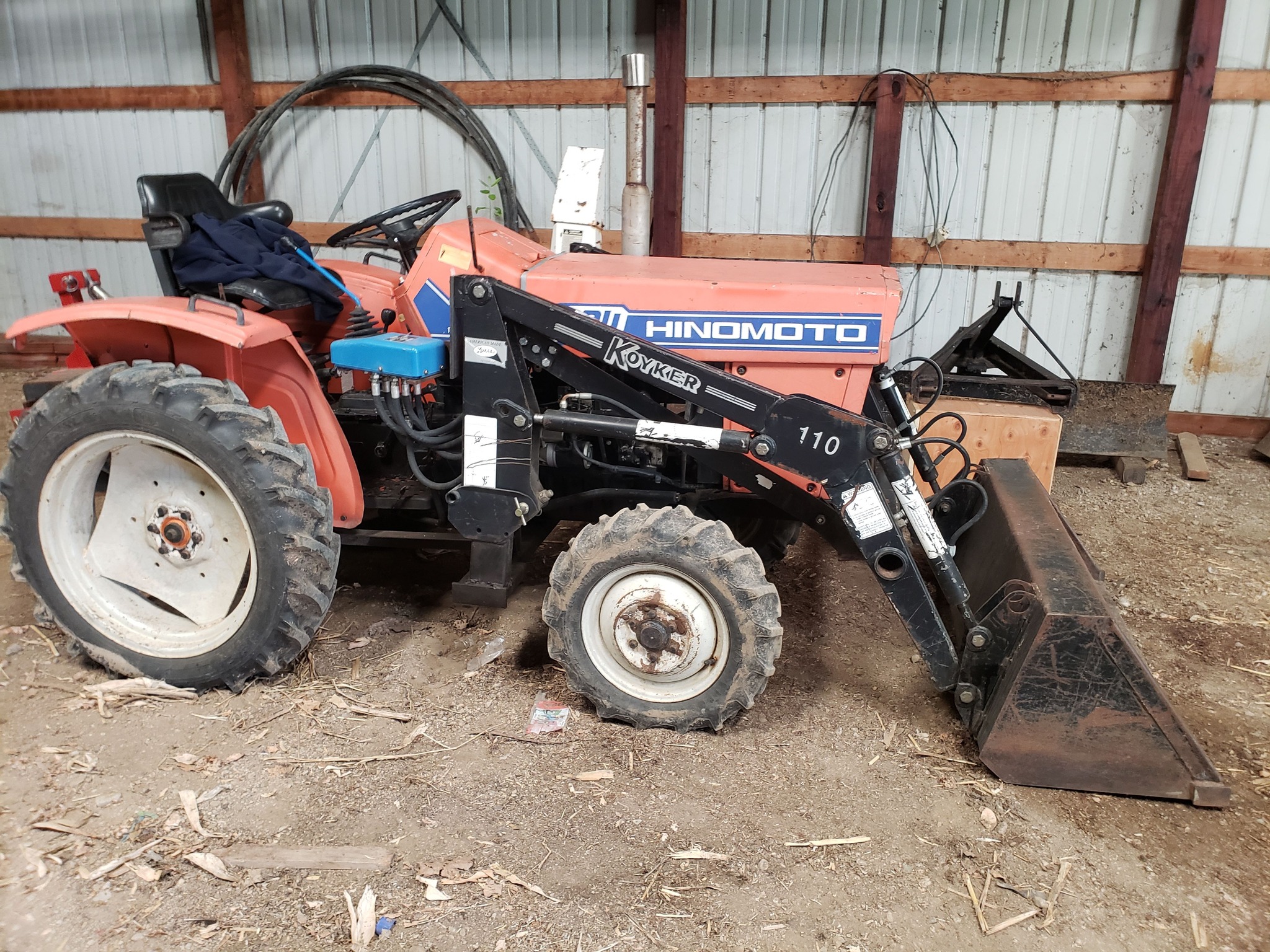 What front loader fits a Hinomoto E184 tractor?