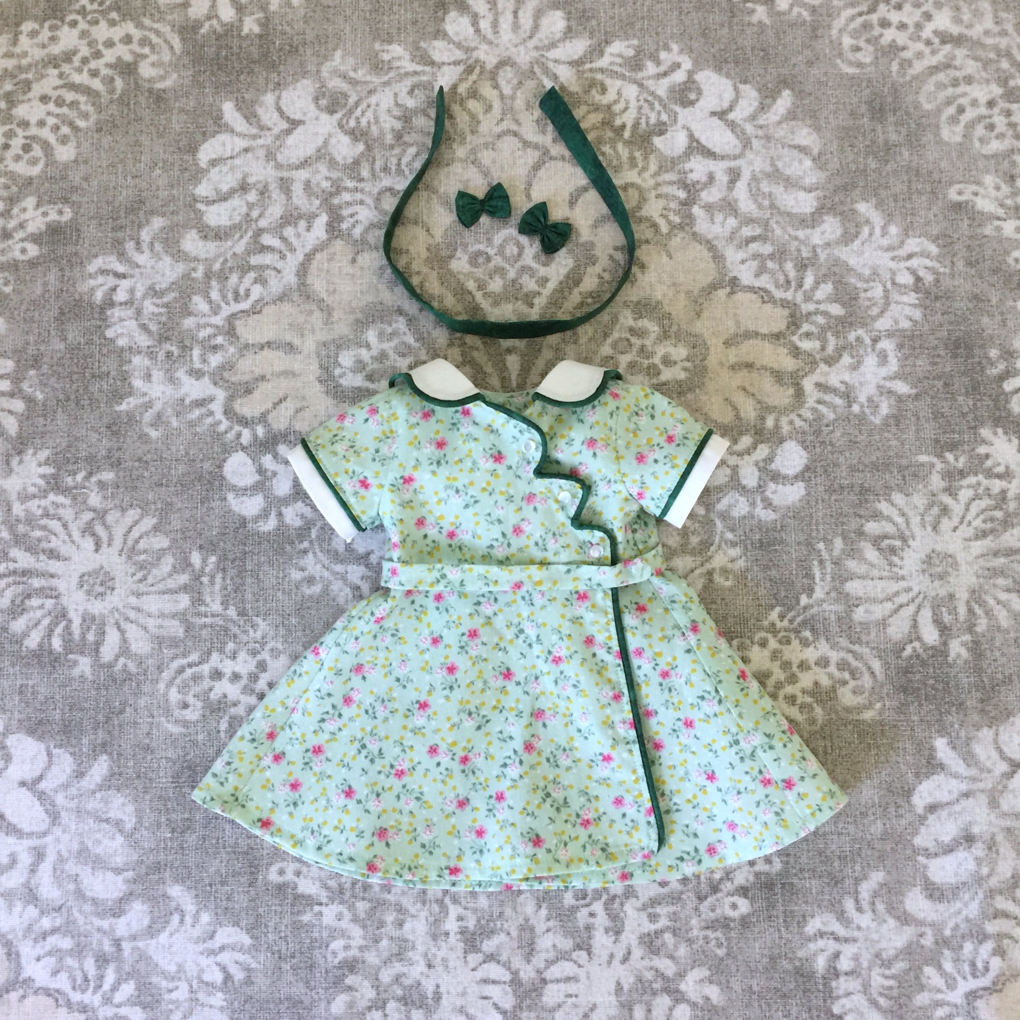 Kit's Birthday Dress,” a feed sack style dress inspired by the original cover illustration of the American Girl book “Happy Birthday, Kit.” This was a custom order. This 1930s era feed sack