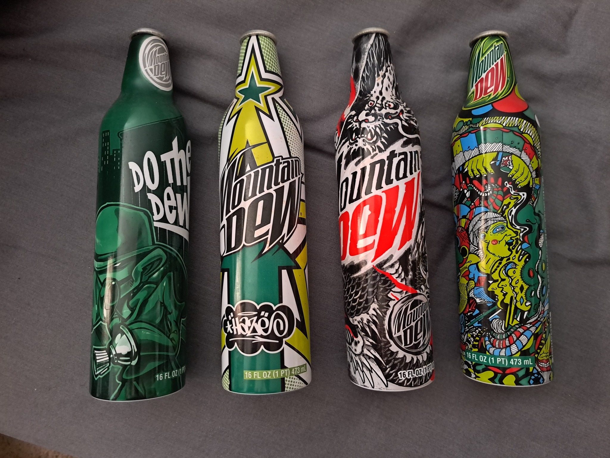 Vintage Mountain Dew green label art metal bottles from late 00's