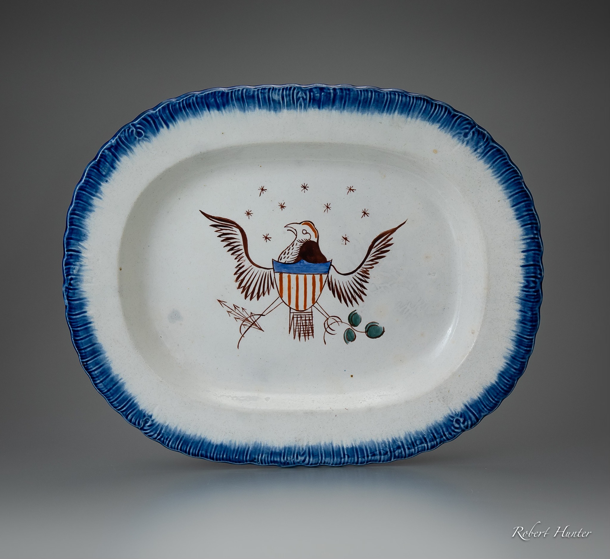 Staffordshire shell-edged plates with America's great seal