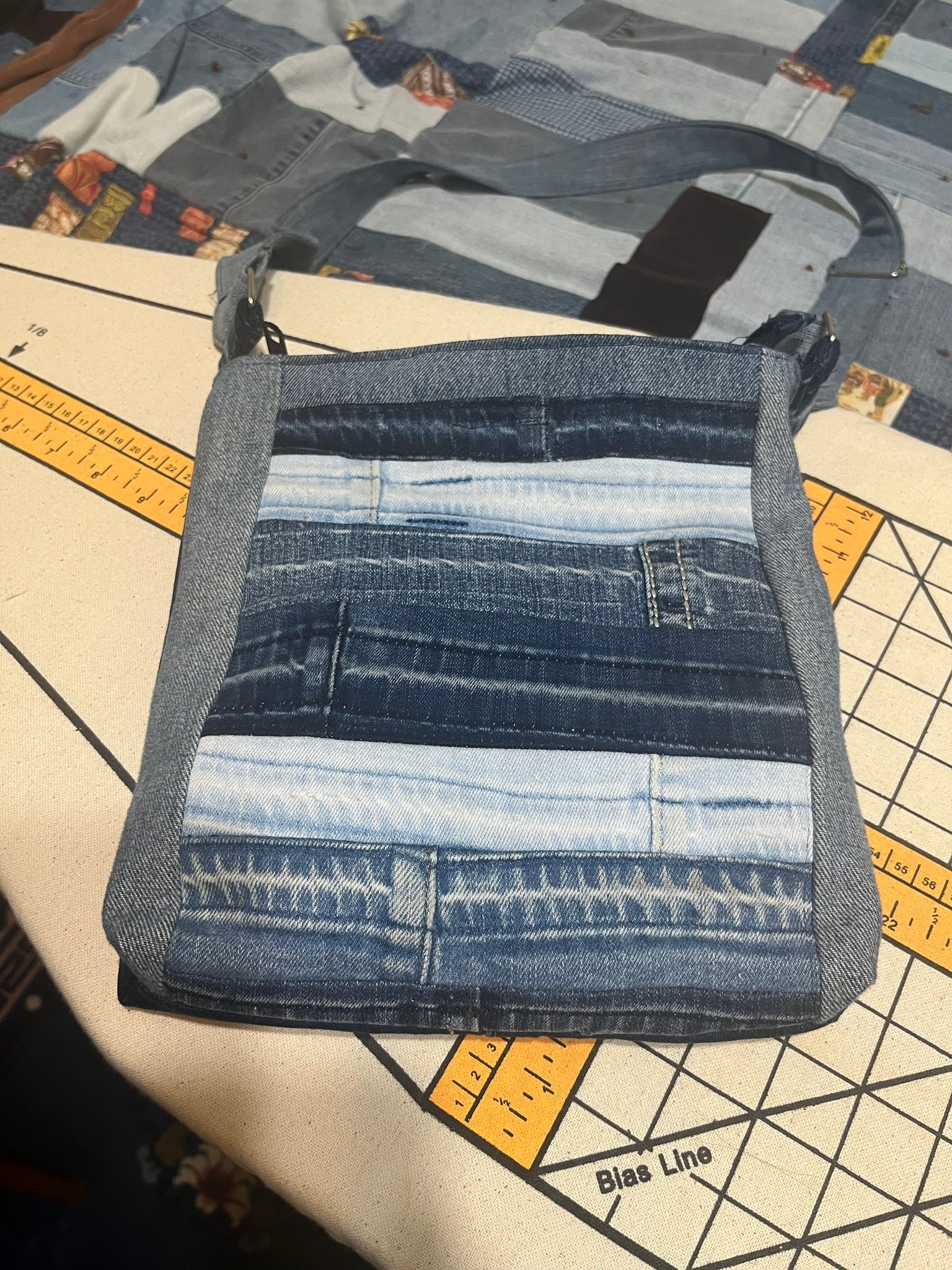 Upcycled denim cross body bag made from ripped jeans