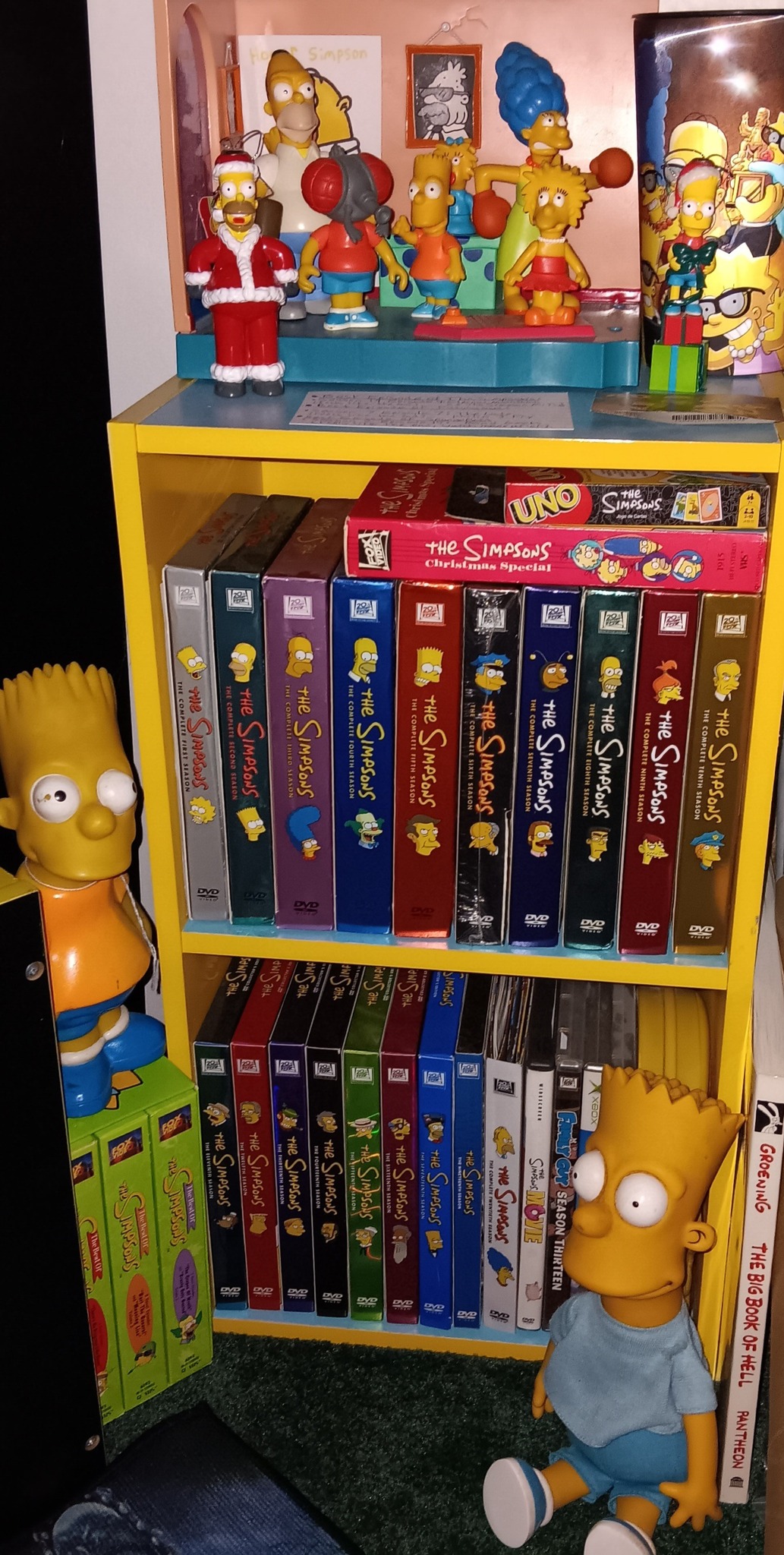 The Simpsons DVD collection on a custom yellow and blue shelf