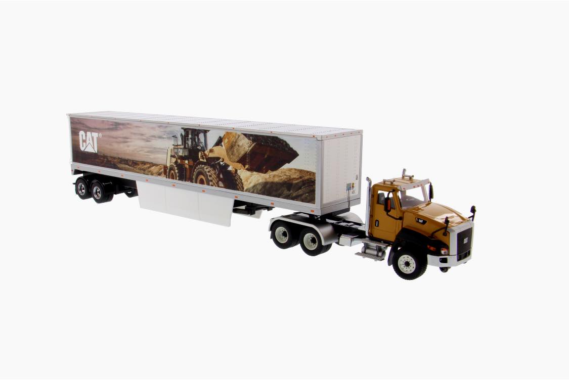 Diecast Masters Cat CT660 model with mural trailer