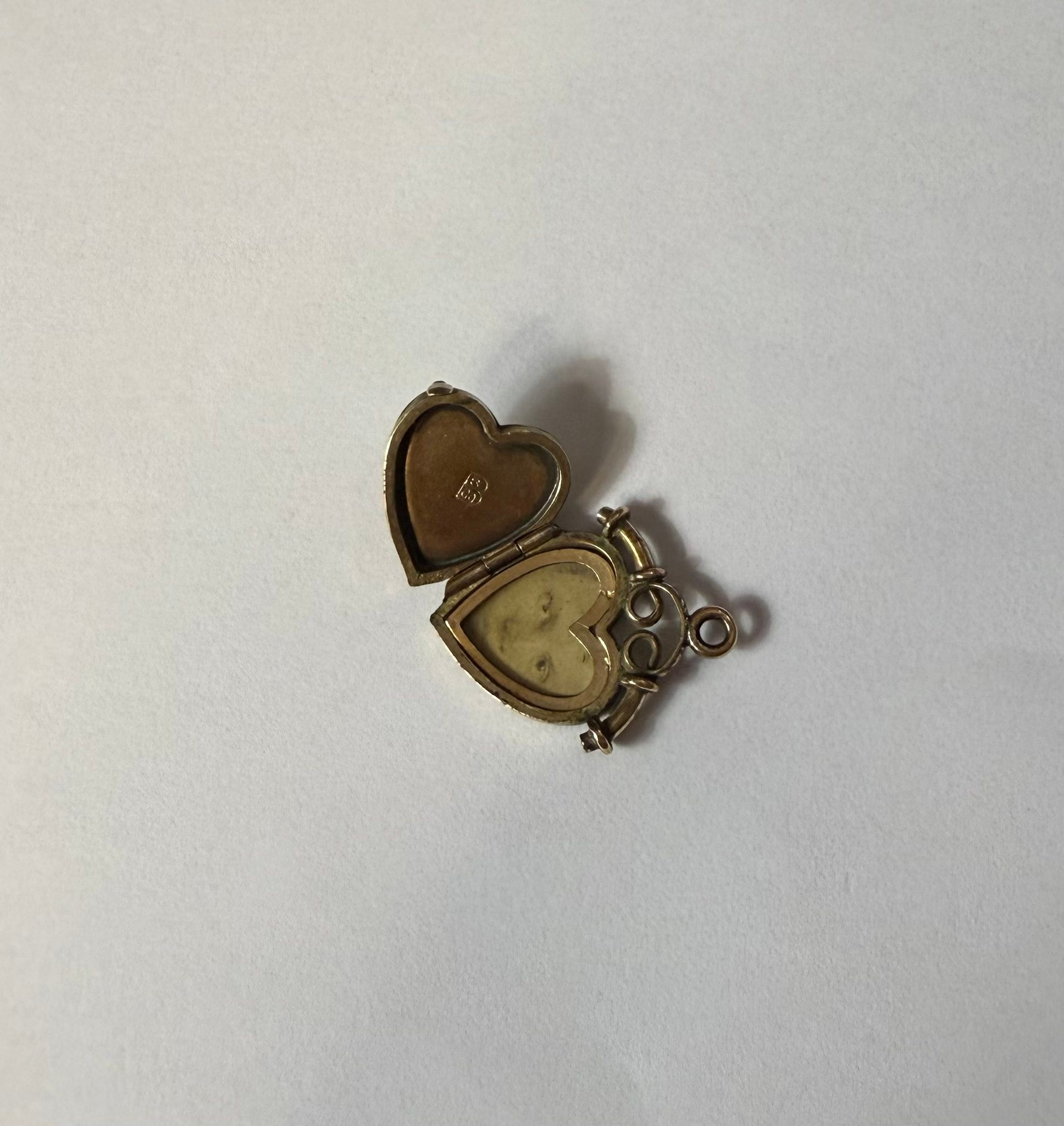 Help identifying locket makers Bixler Co and unknown mark