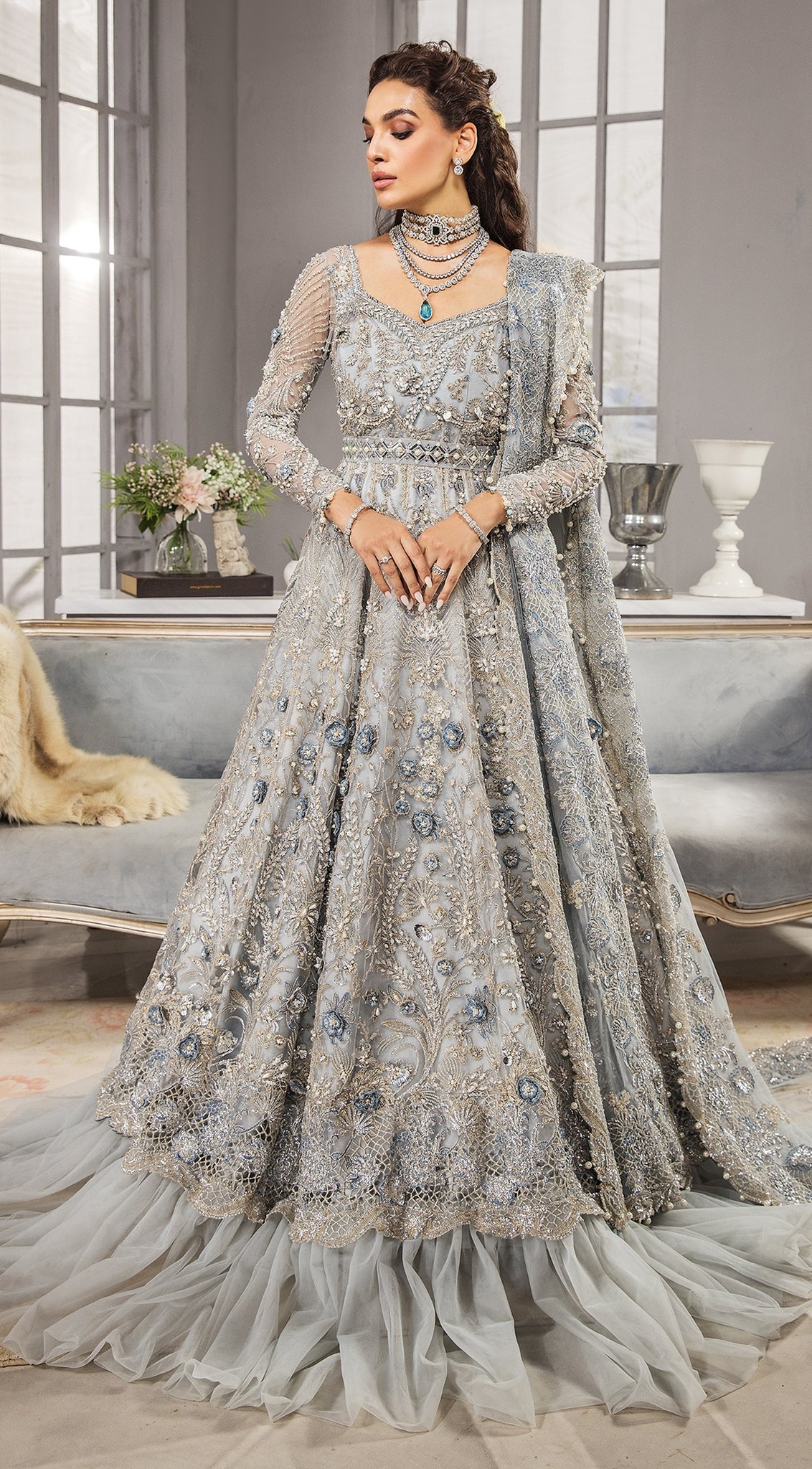 grey bridal dress pakistani Silver Lehenga Gown for Wear is a gorgeous belted misty grey maxi uniquely accentuated with chic net ruffles and adorned with a mesh of intricate embroideries making it one silver grey walima dress
