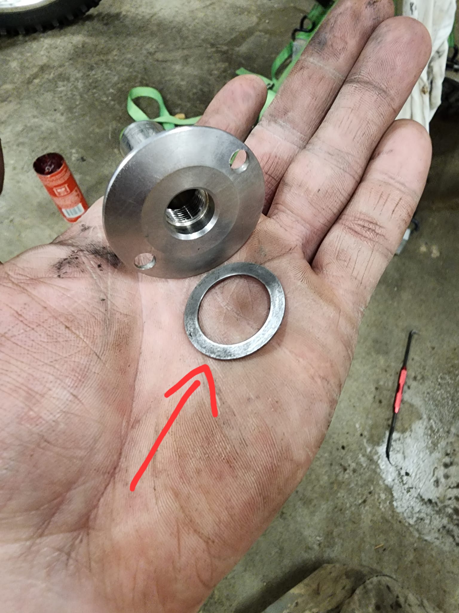 What holes are on a rear swing arm pivot?