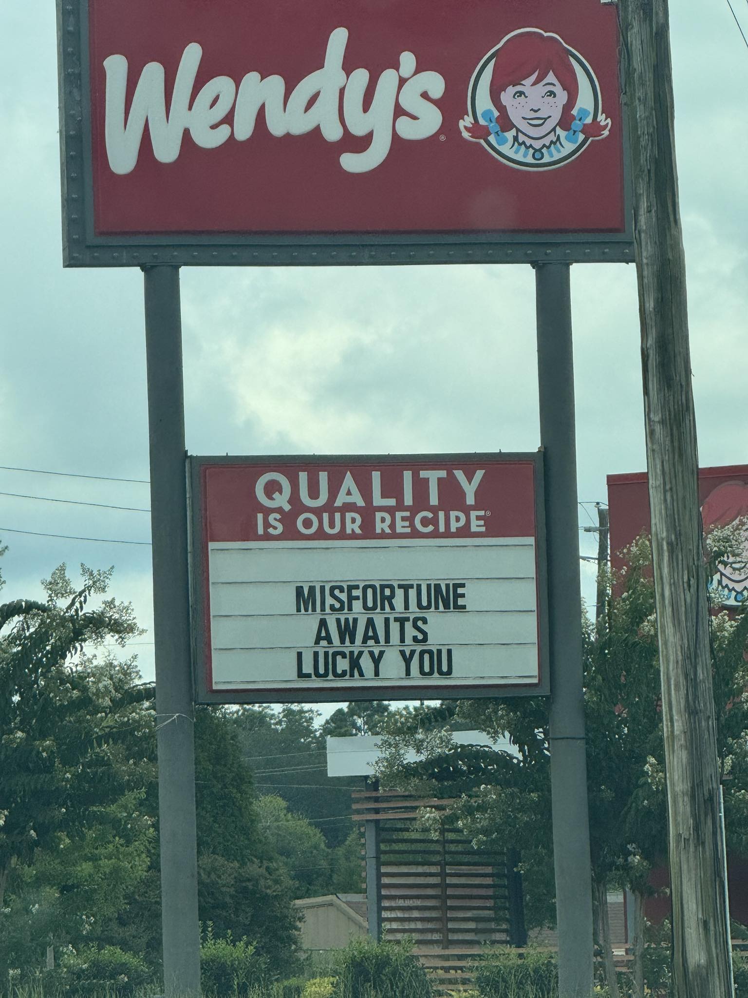 What's up with the sign at Wendy's? Wendy's QUALITY IS OUR RECIPE