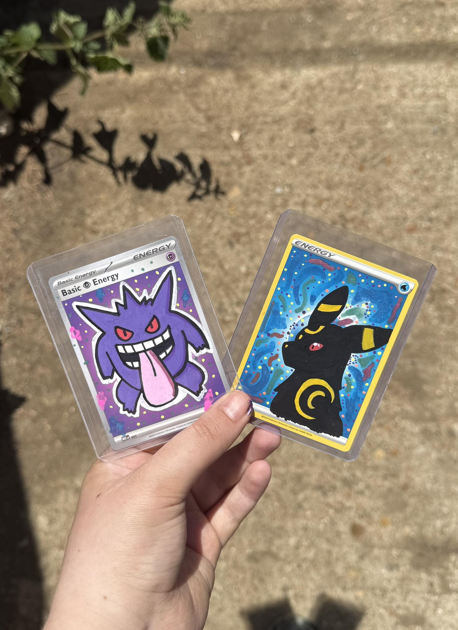 Hand-drawn Pokemon cards including Gengar and Umbreon