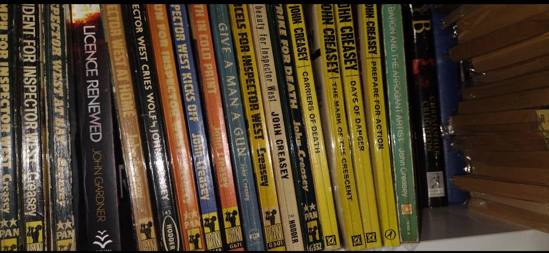 John Creasey book collection with hundreds of paperbacks