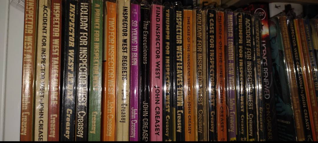 John Creasey book collection with hundreds of paperbacks