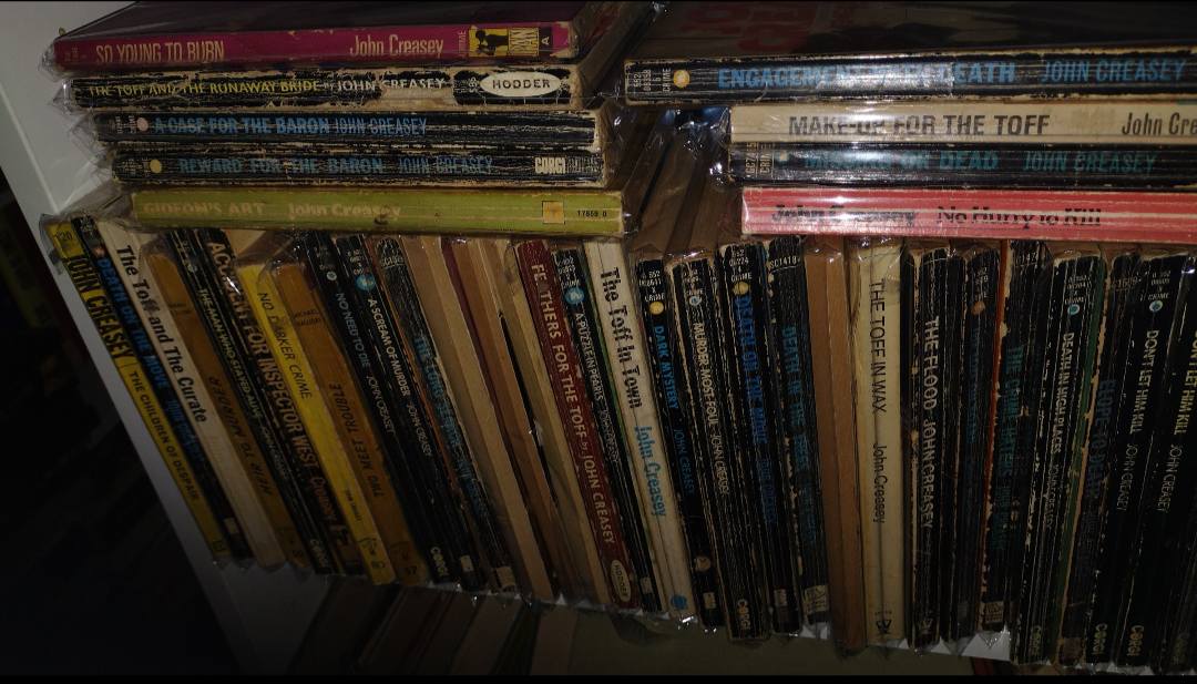 John Creasey book collection with hundreds of paperbacks