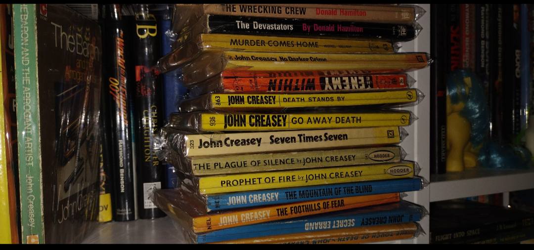 John Creasey book collection with hundreds of paperbacks