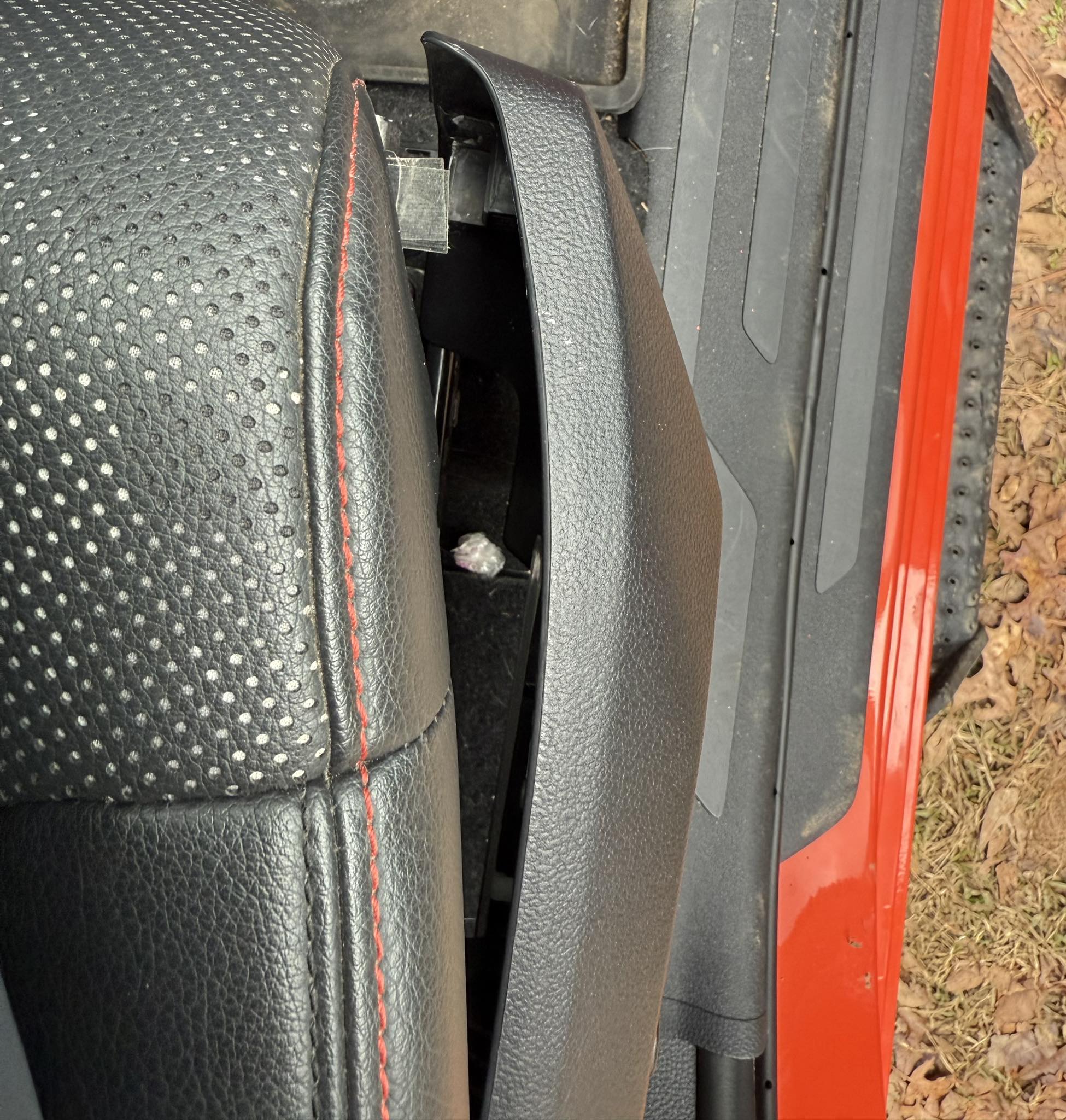 Trying to figure out how to remove the hard plastic trim piece 