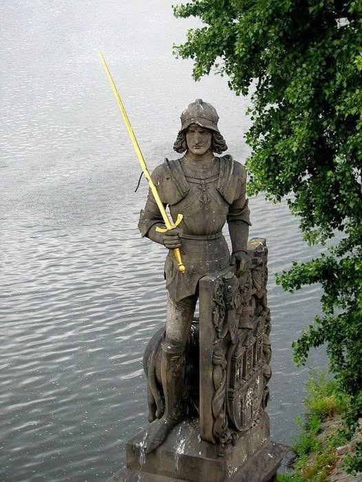 The Torchbearer and Lion statue symbolizing Czech banking resilience