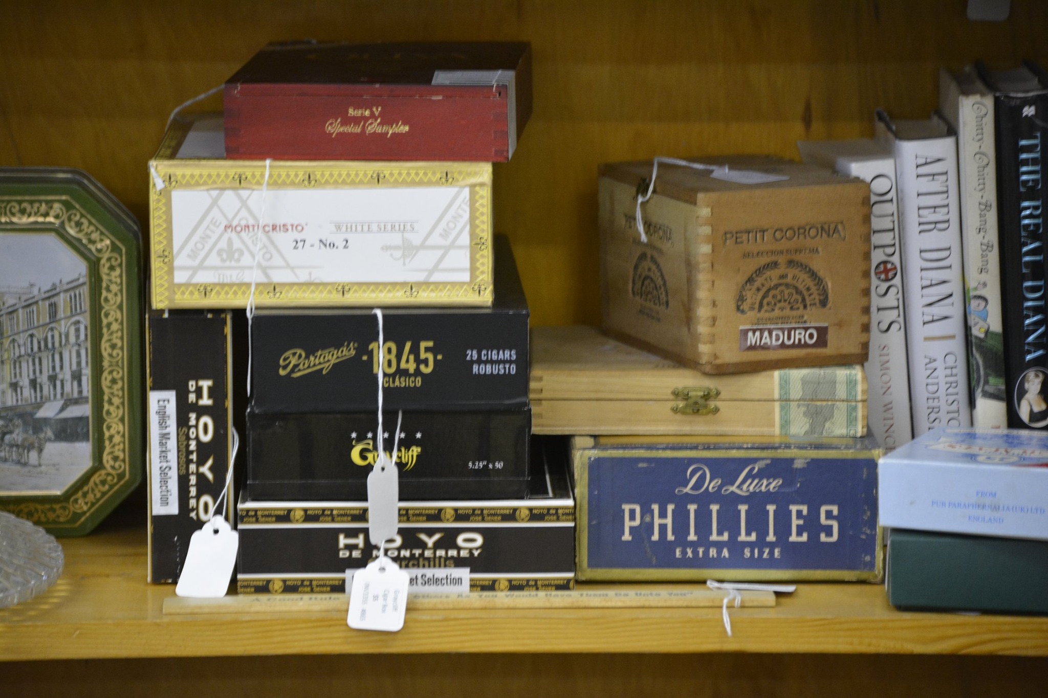 Vintage wooden cigar box is brown with a hinged lid and metal