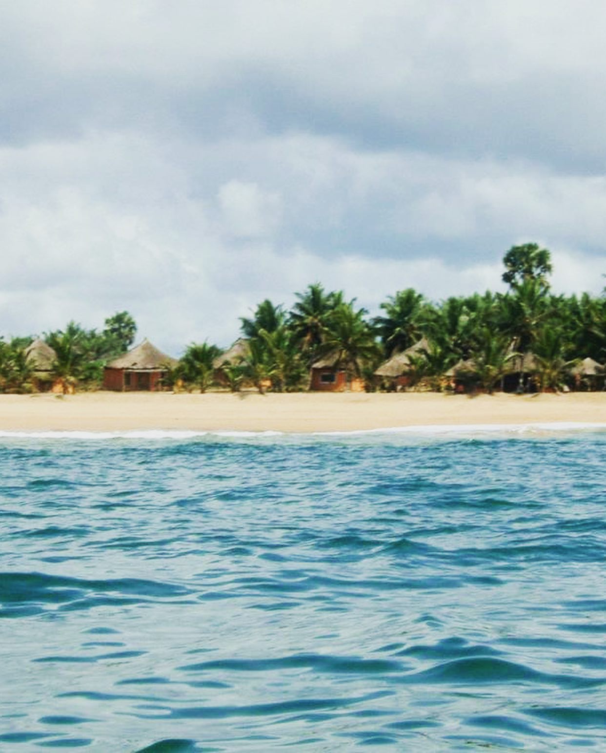 The unspoilt beach at Akwidaa,... - The Coconut Contract