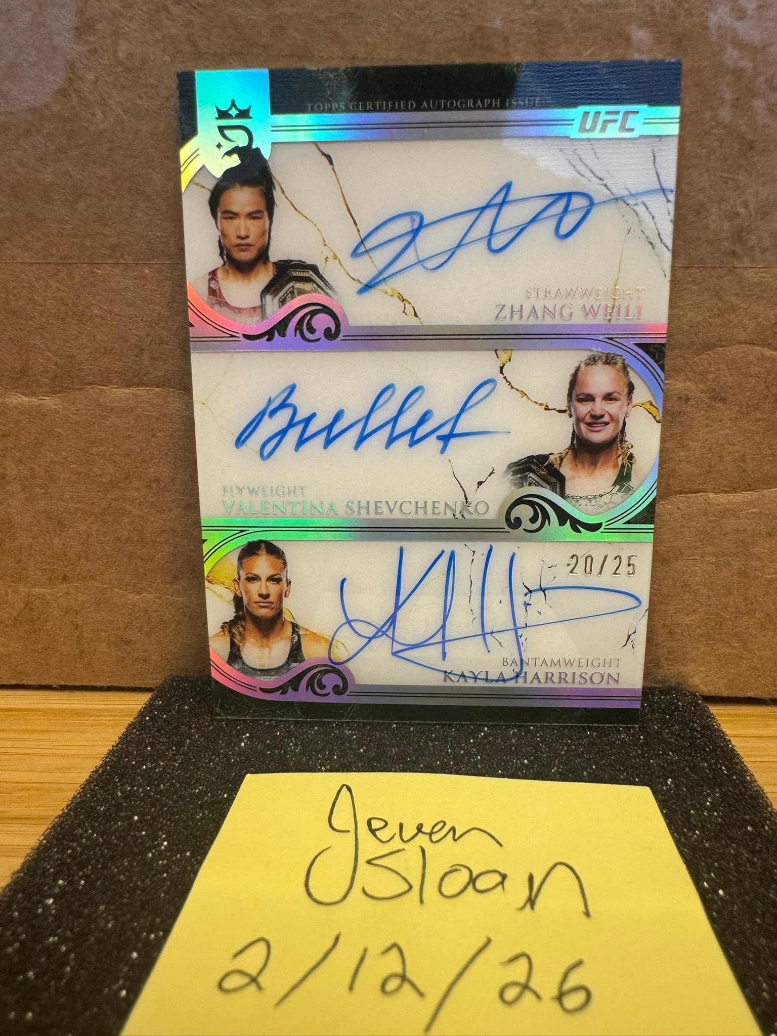 UFC autograph cards of Zhang Weili, Valentina Shevchenko, and
