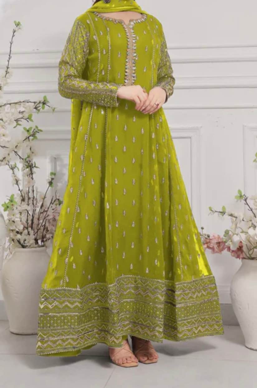 Beautiful lime green dress, long and flowy. Has pretty silver and gold embroidery on neckline, sleeves, and bottom border. Comes with matching dupatta, also has little silver details. Looks super elegant for