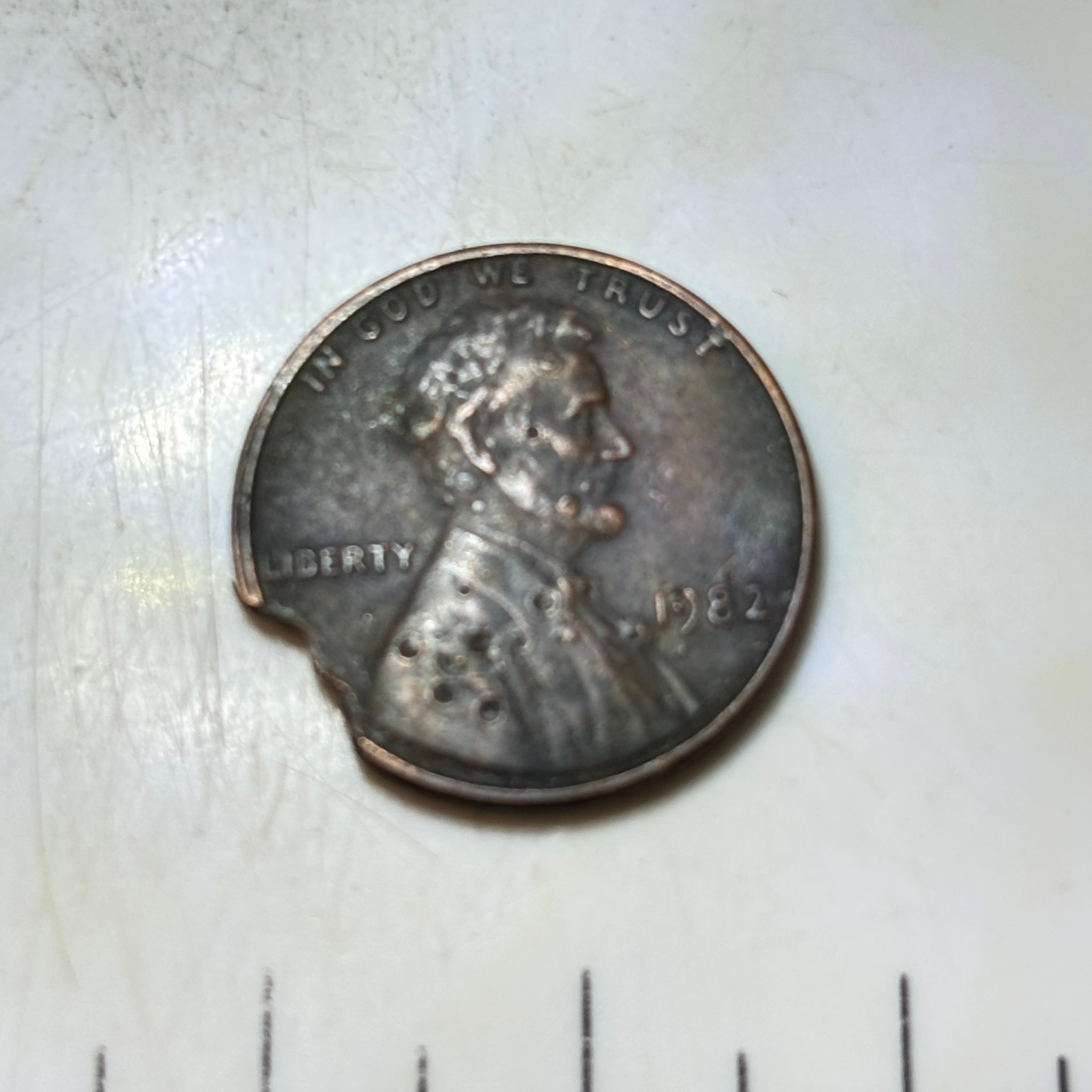 What is this coin with hole spots?