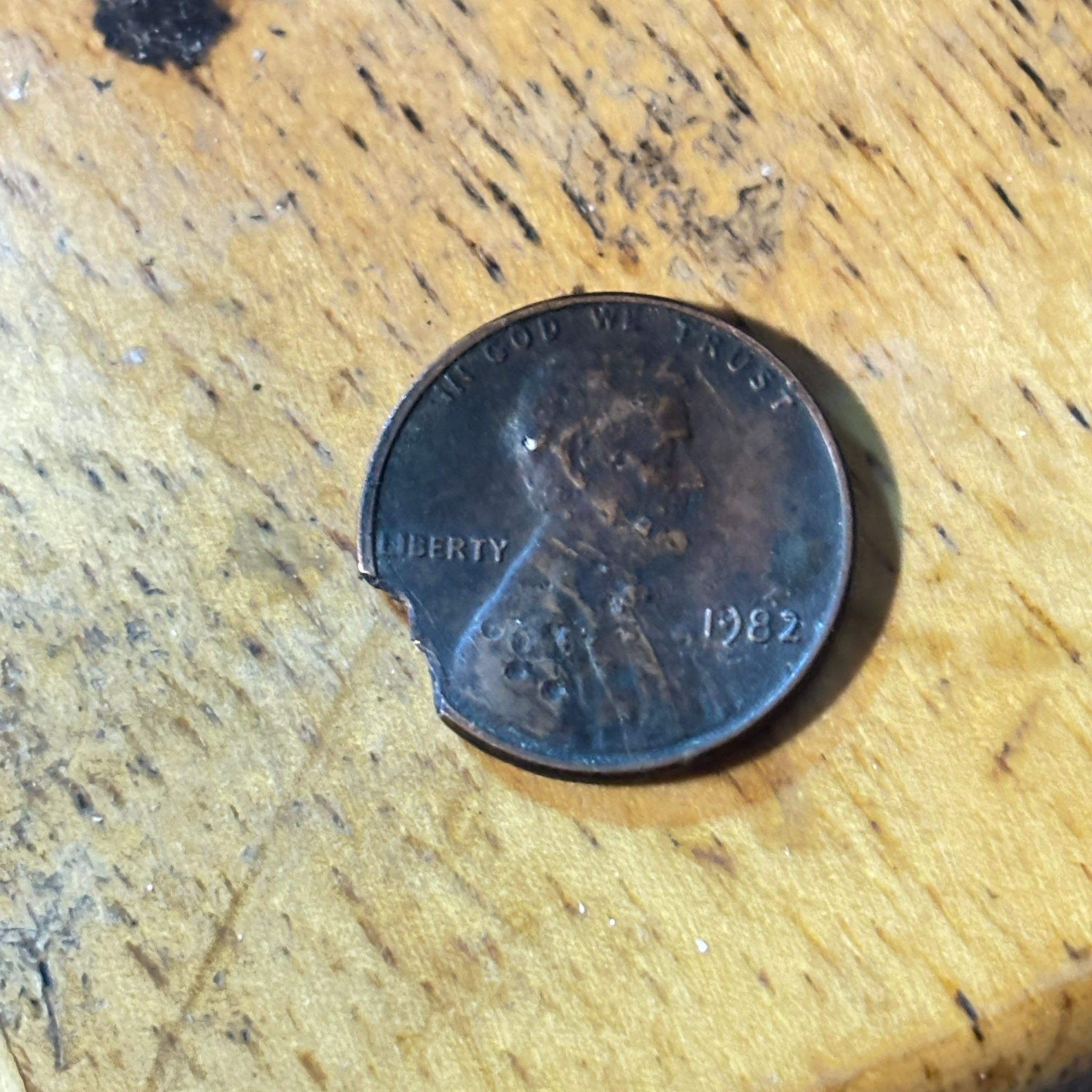 What is this coin with hole spots?