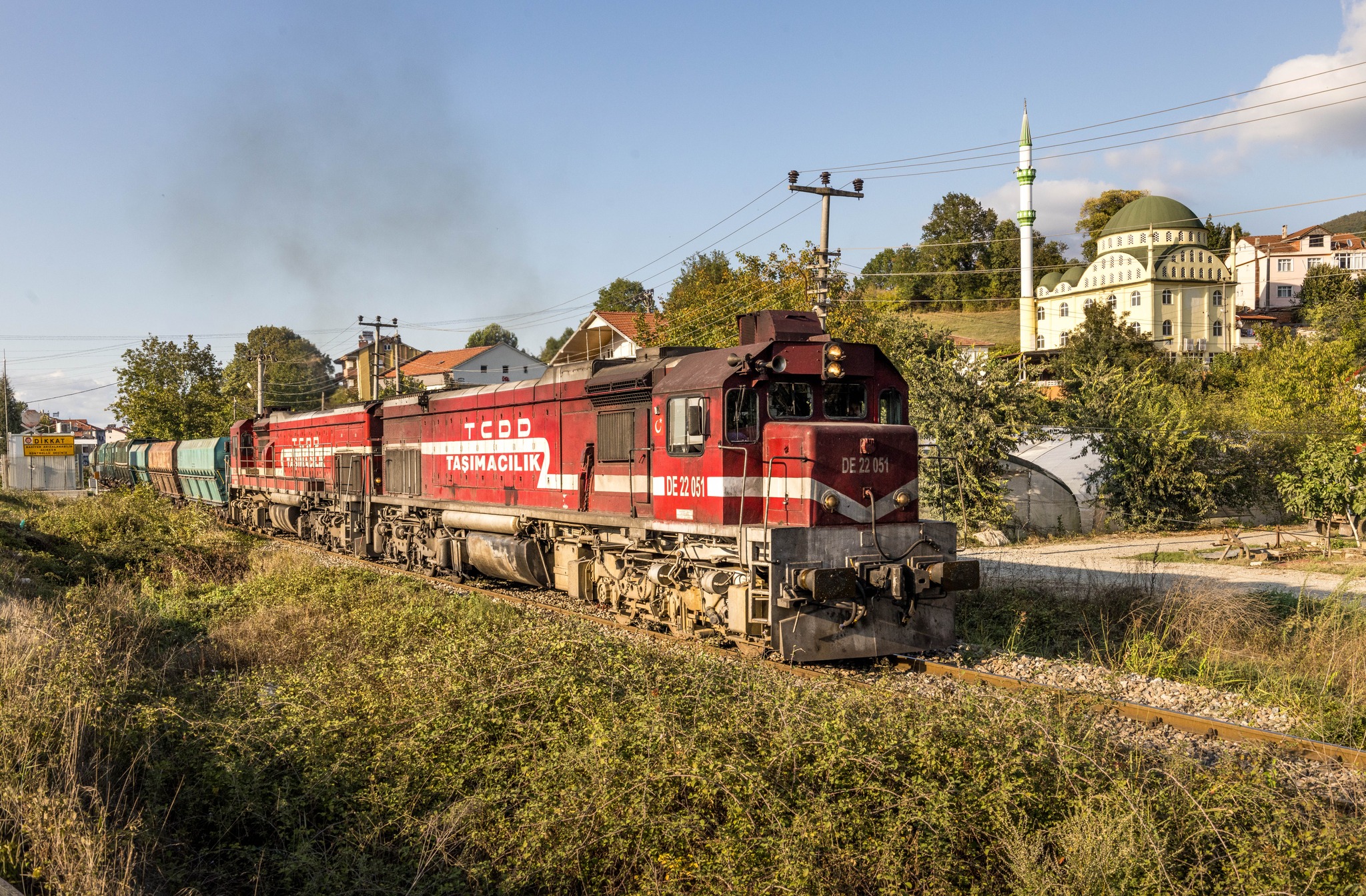 Markus - A unit train passes a mosque in Bakacakkadi in the early ...