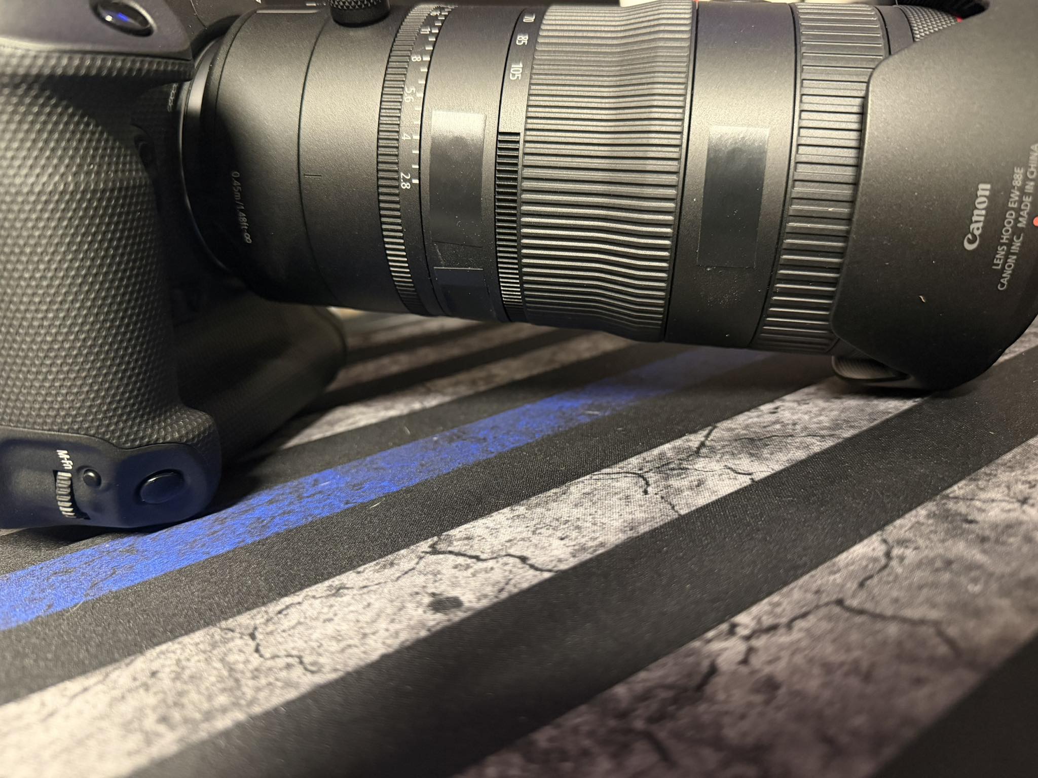 Can I add tape over electronic zoom holes on Canon 24-105mm 2.8 lens?