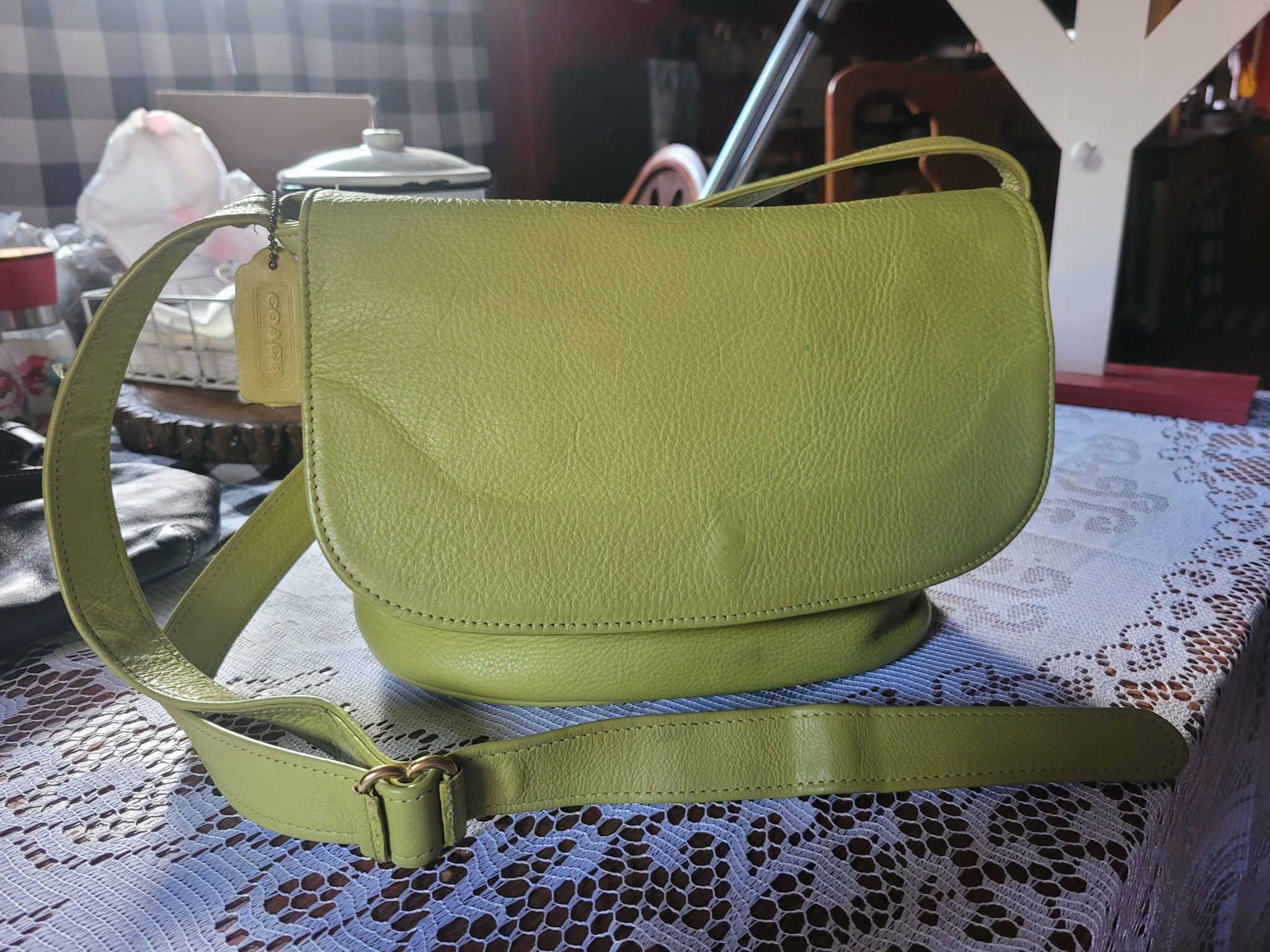 What is the value of a vintage lime green leather coach purse?