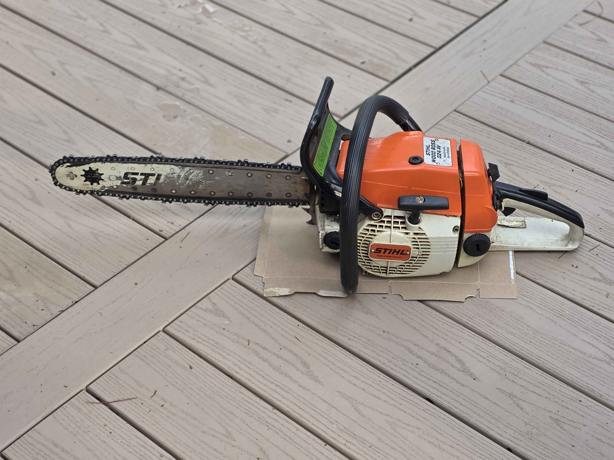 024 Wood Boss gas powered chainsaw with hard Stihl case. Owners 