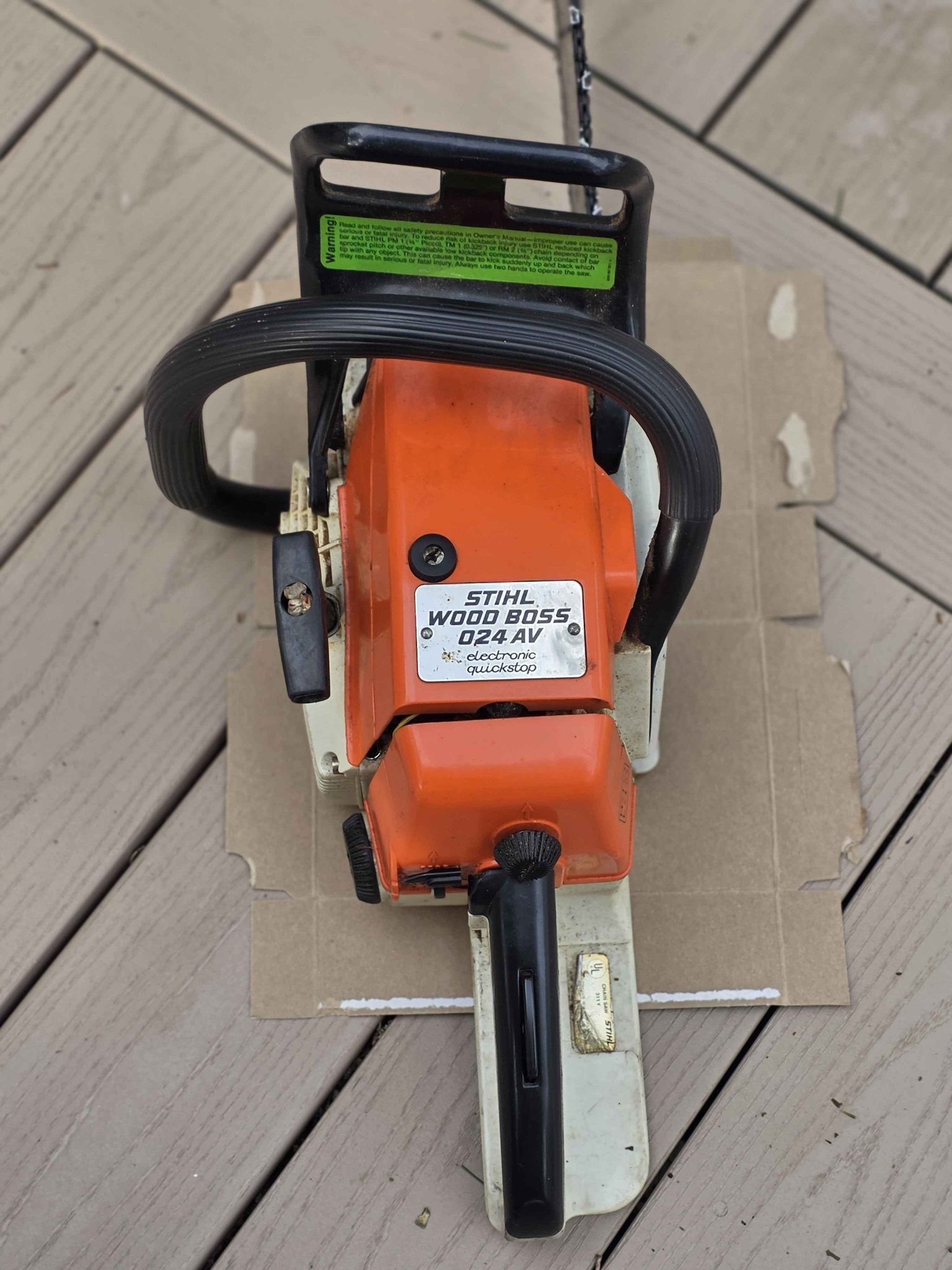 024 Wood Boss gas powered chainsaw with hard Stihl case. Owners 