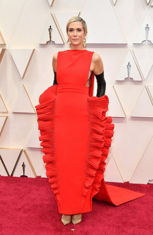 red dress fifty shades of grey actress Dakota Johnson heats it up with a one-shouldered Saint Laurent gown with a glittery, rope-y accent. Meanwhile, actress Anna Kendrick shows up looking glam in a multi tiered