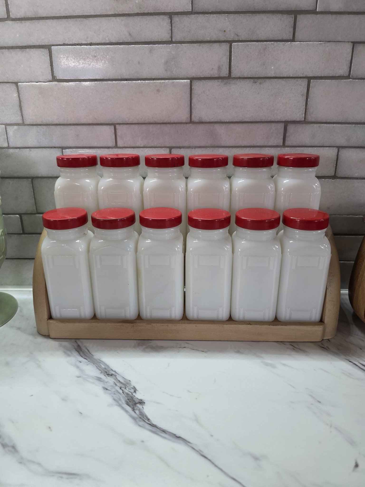 Vintage Griffith milk glass spice jars with wooden rack