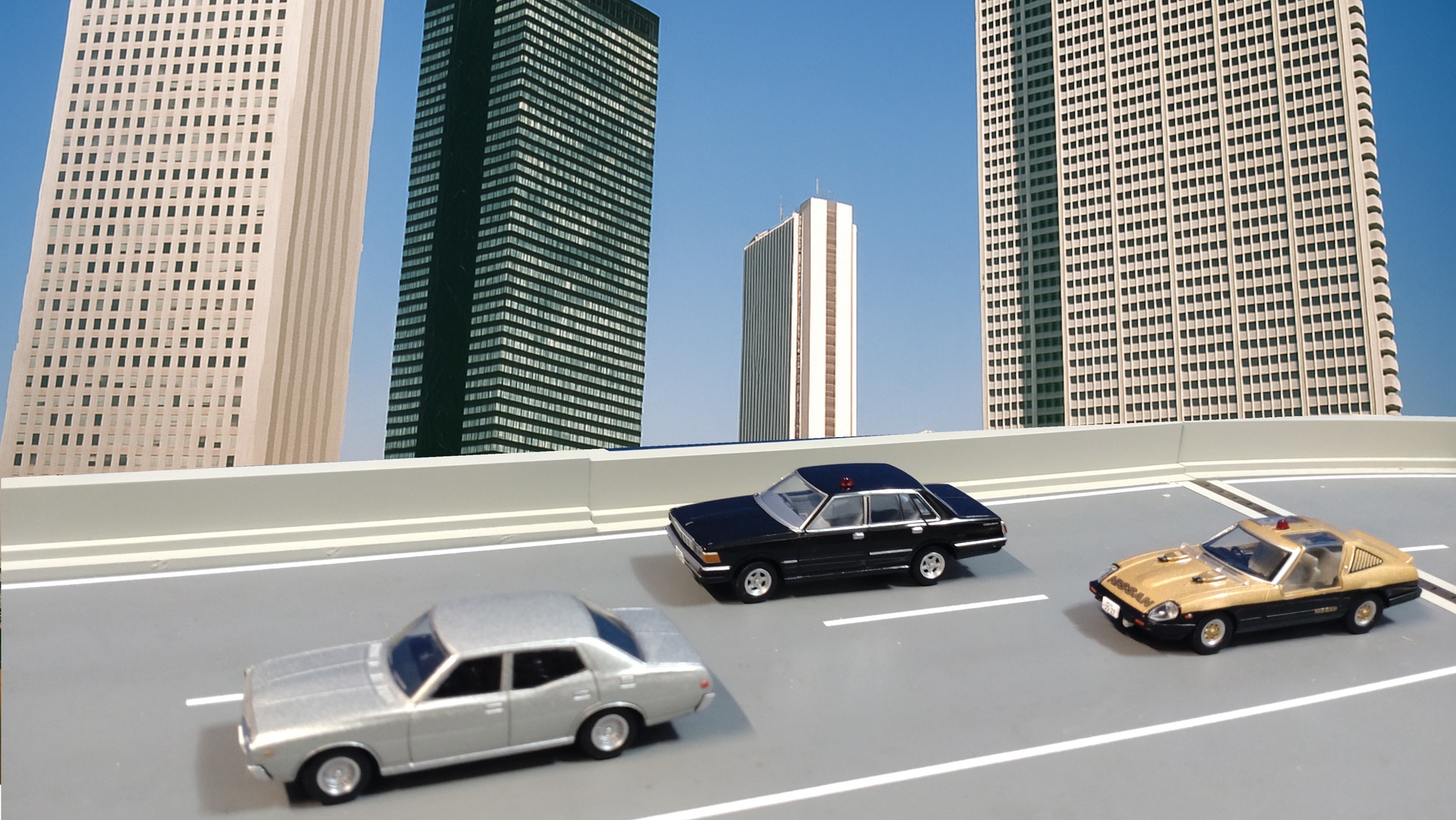 A 1/64 scale Tomica Limited Vintage NEO diorama scene featuring