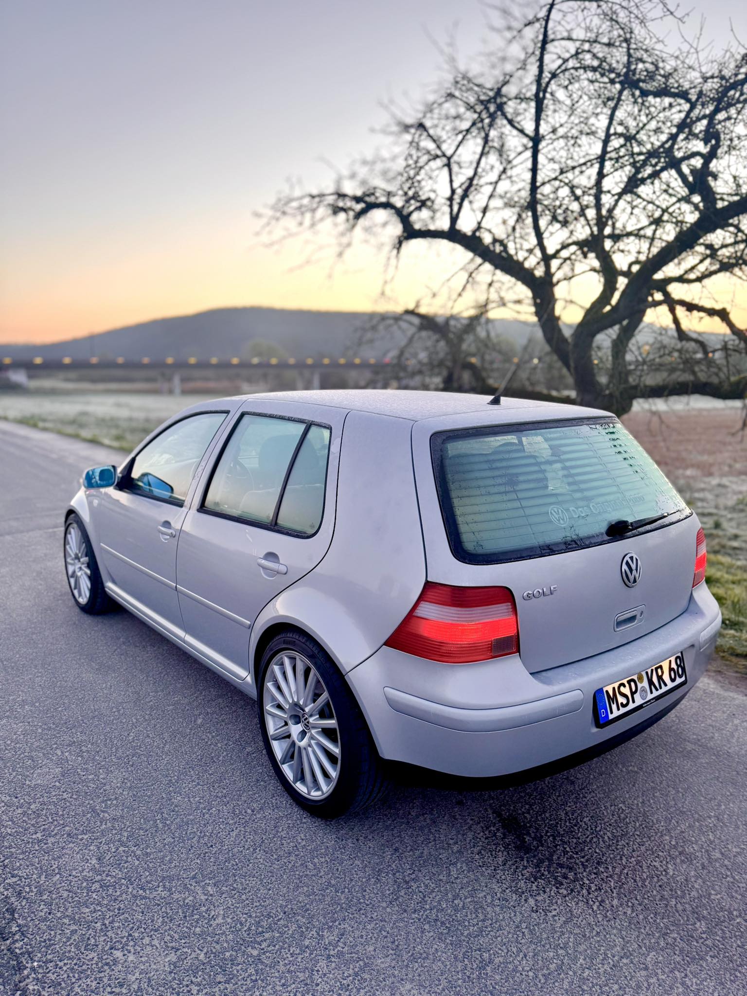 Silver Volkswagen Golf with OZ Aristo wheels and KW V2 suspension